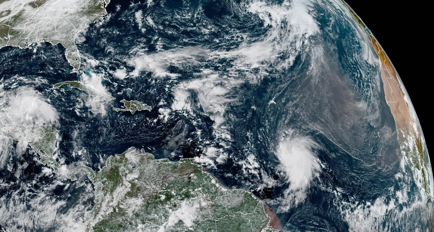A satellite image of Tropical Storm Jerry, churning over the Atlantic Ocean Tuesday