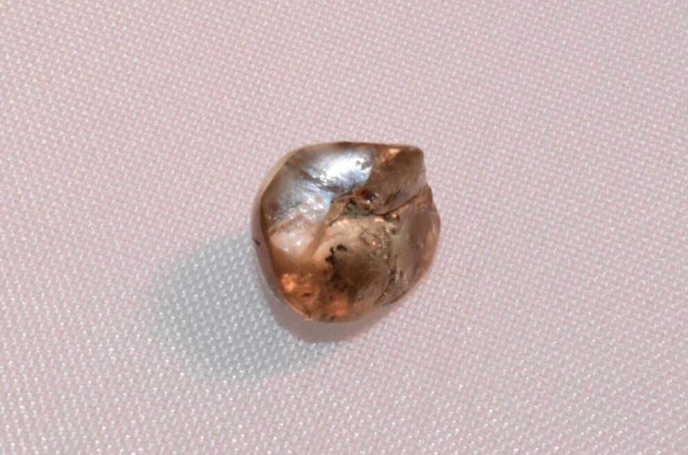 The white round diamond was about the size of a pea