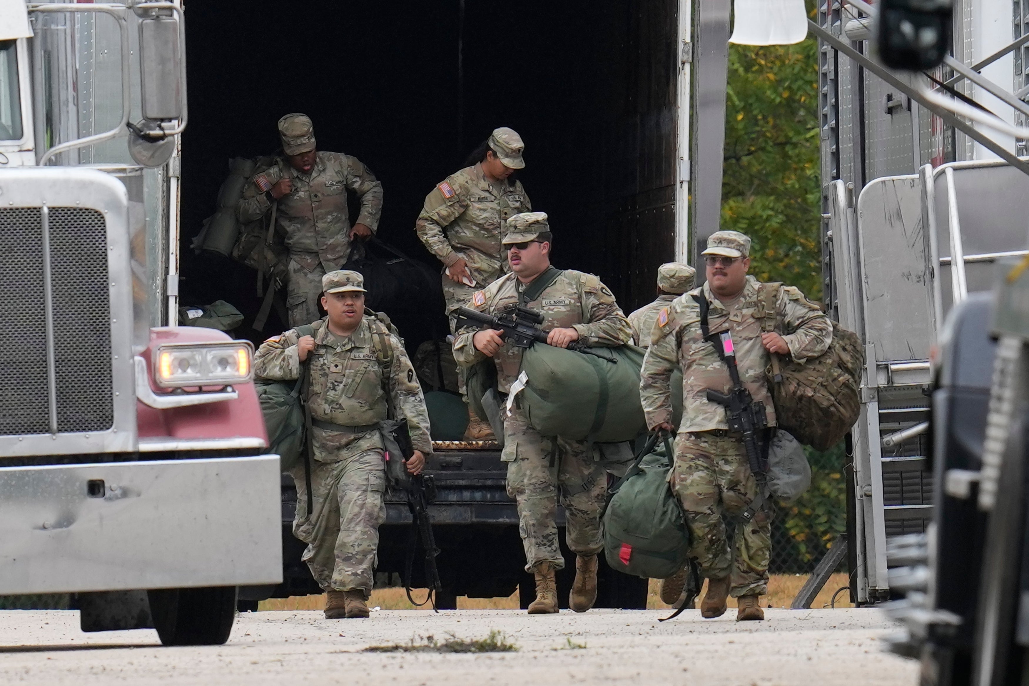 State and local officials in Illinois have sued the Trump administration to stop the deployment of hundreds of state and Texas National Guard troops to Illinois, who were seen arriving in the state on Tuesday