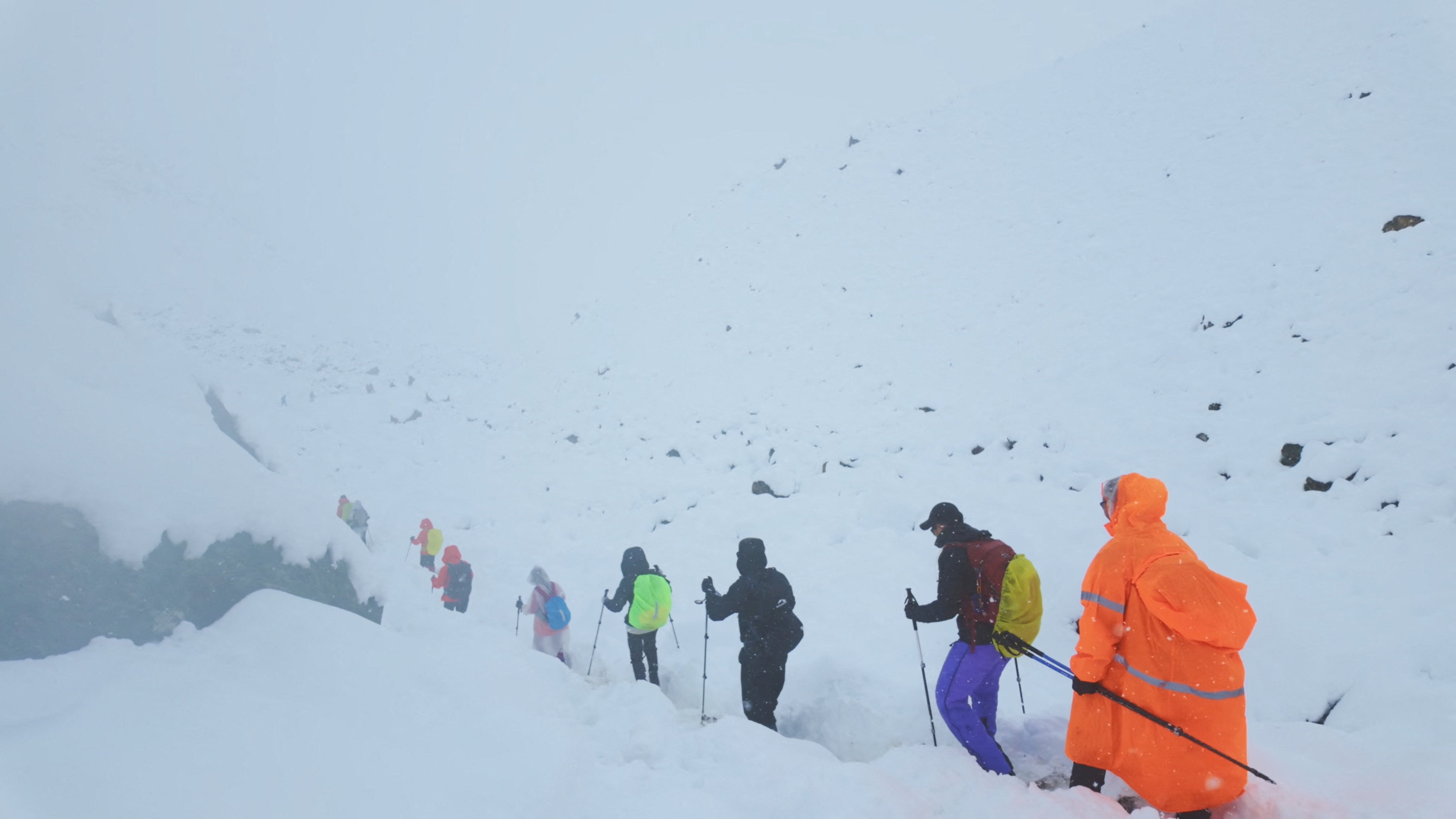 Video footage shows trekkers leaving their campsite as unusually heavy snow and rainfall pummeled the Himalayas