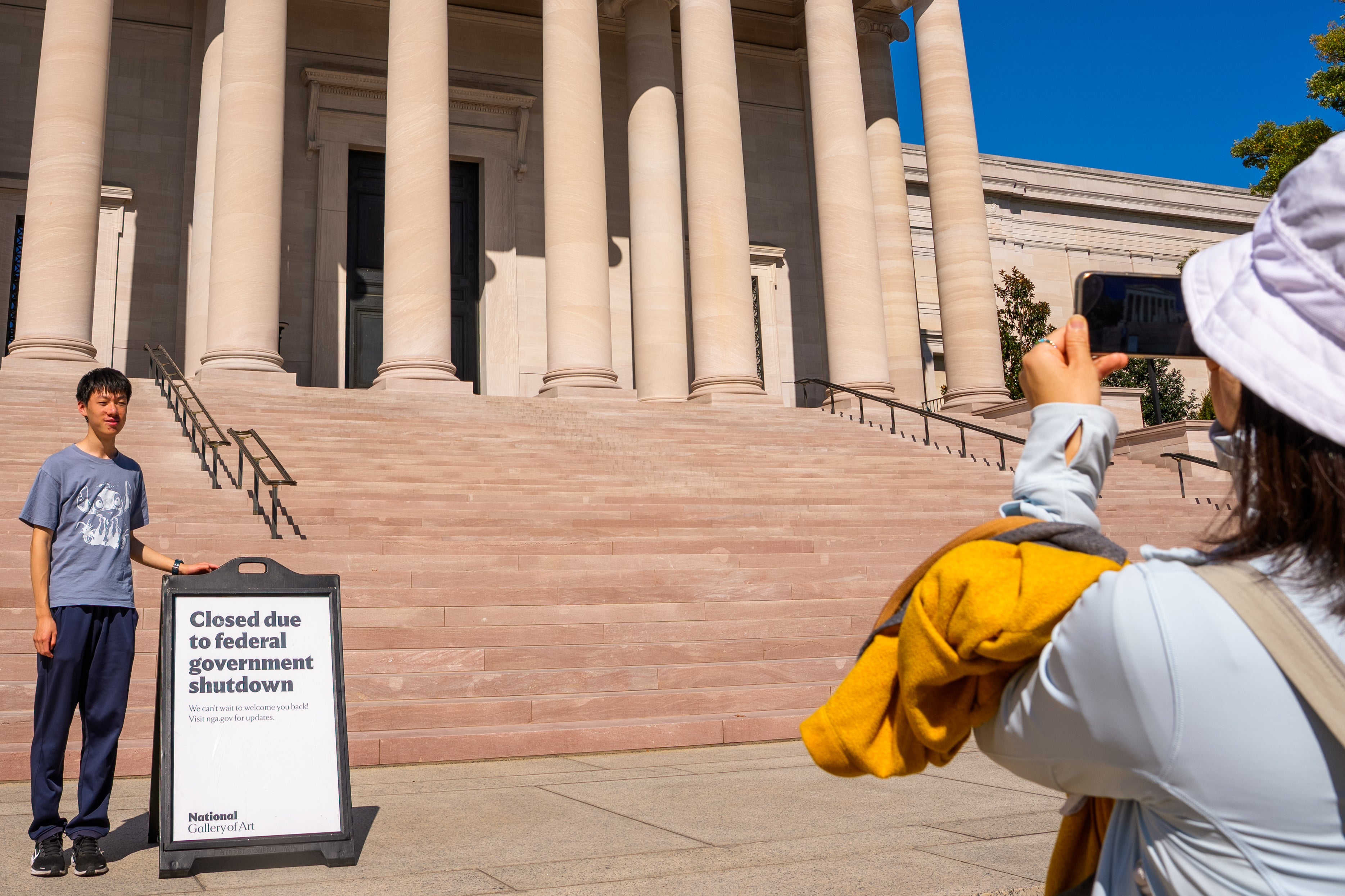 The federal shutdown has closed government buildings and delayed services. Trump has threatened not to give back pay to workers on furlough because of the closure.