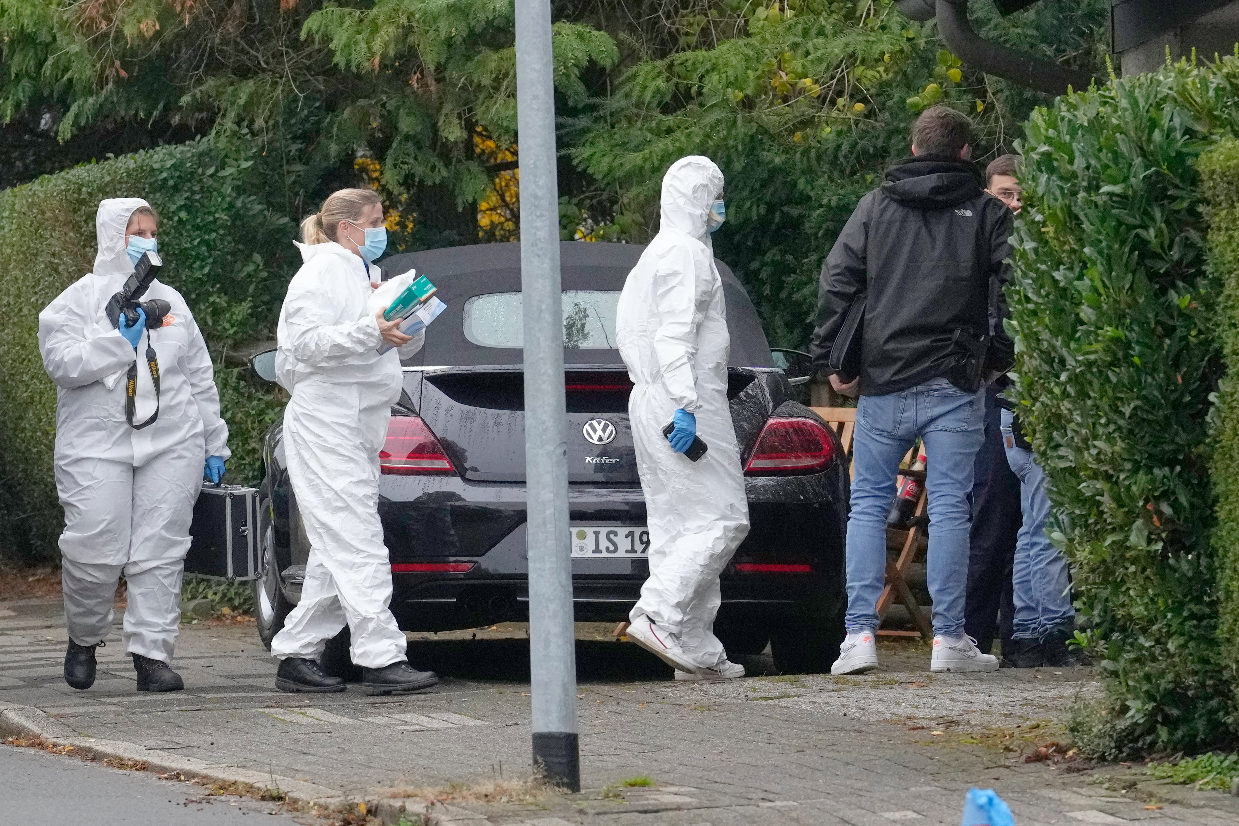 Forensic investigators on a street in Herdecke after the stabbing
