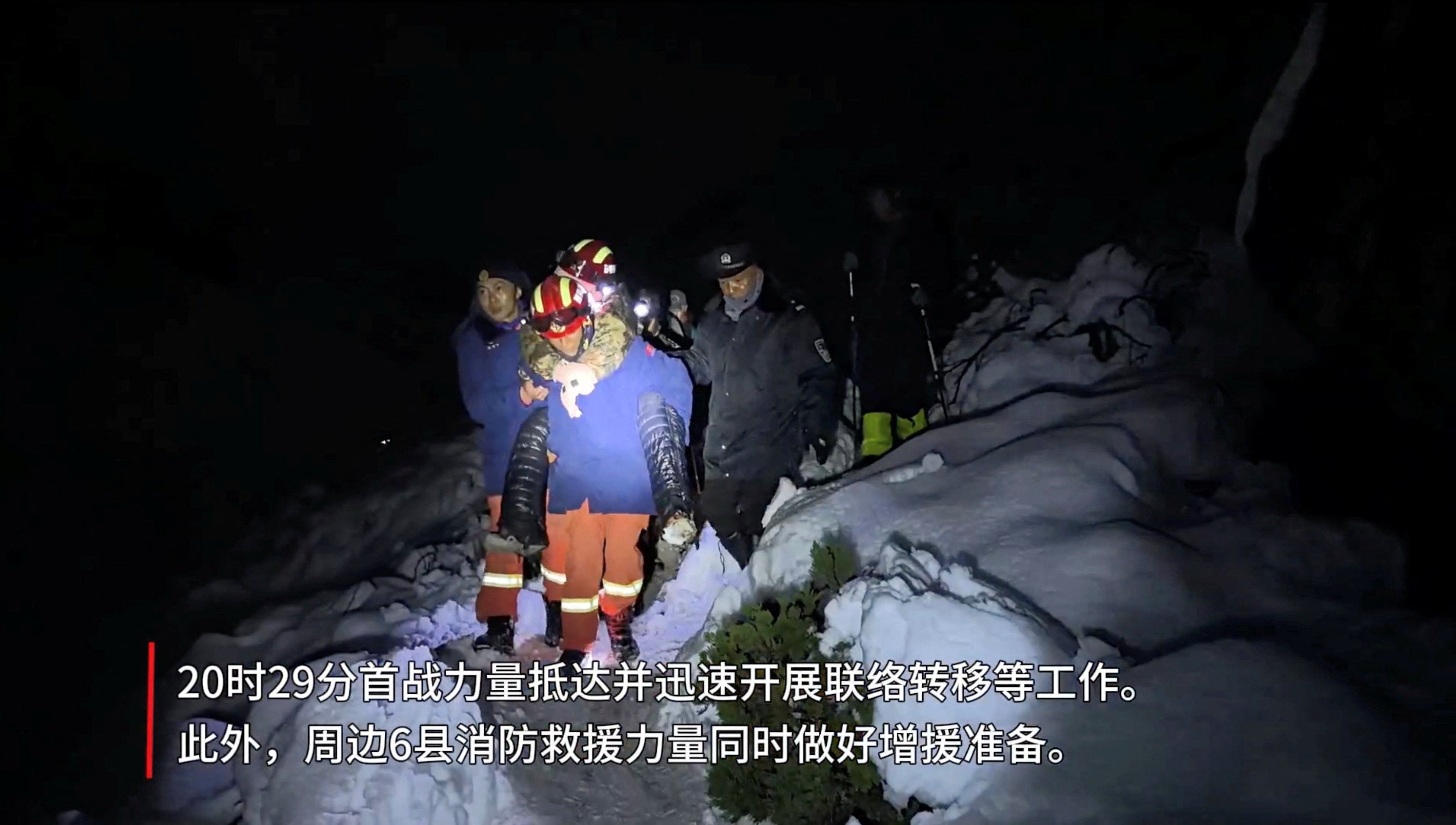 Tibetan firefighters rescue trekkers from Mount Everest after they were stranded by a blizzard in Tingri, Tibet Autonomous Region, China