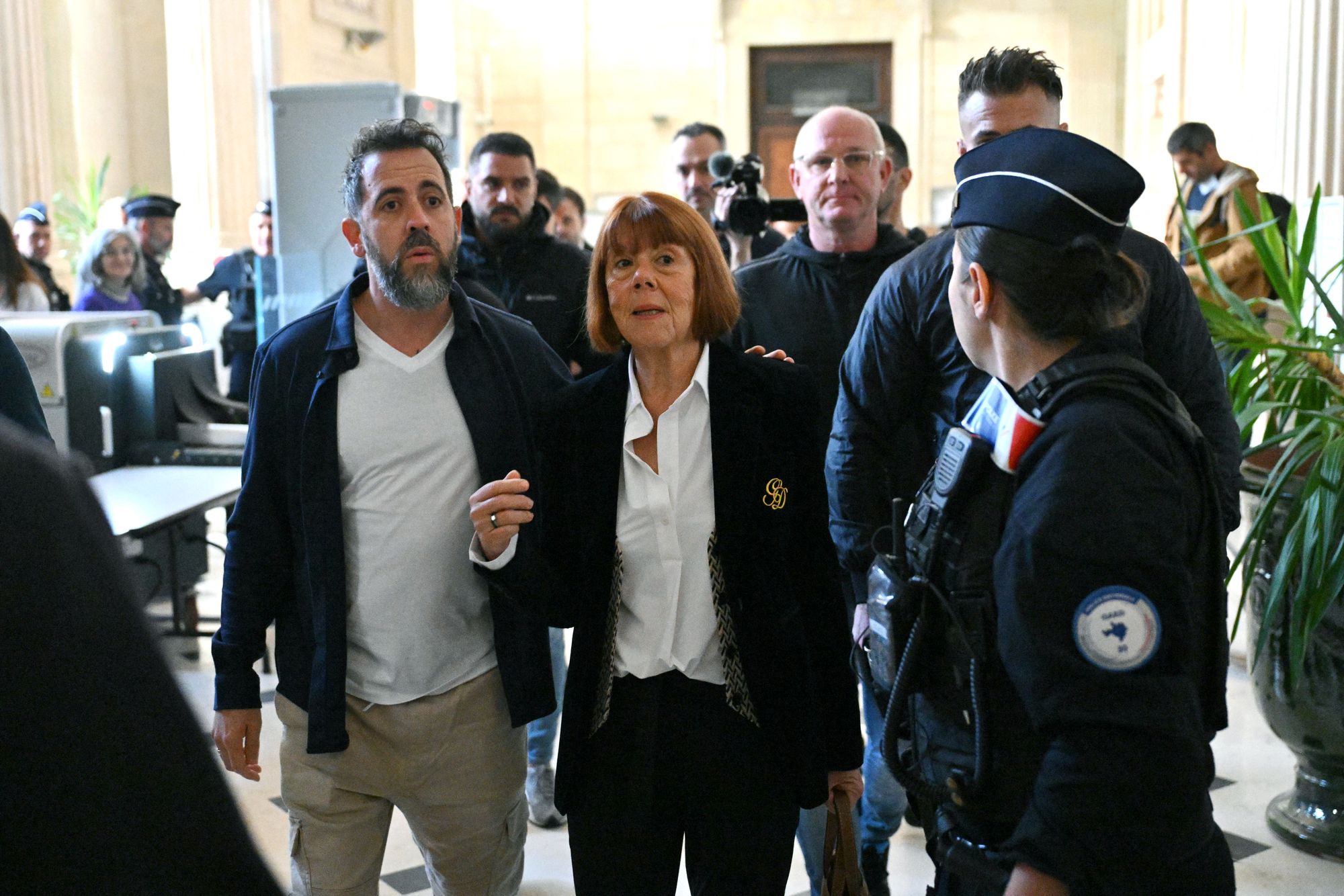 Giles Pelicot and her son Florian arrive for the appeal hearing on 7 October