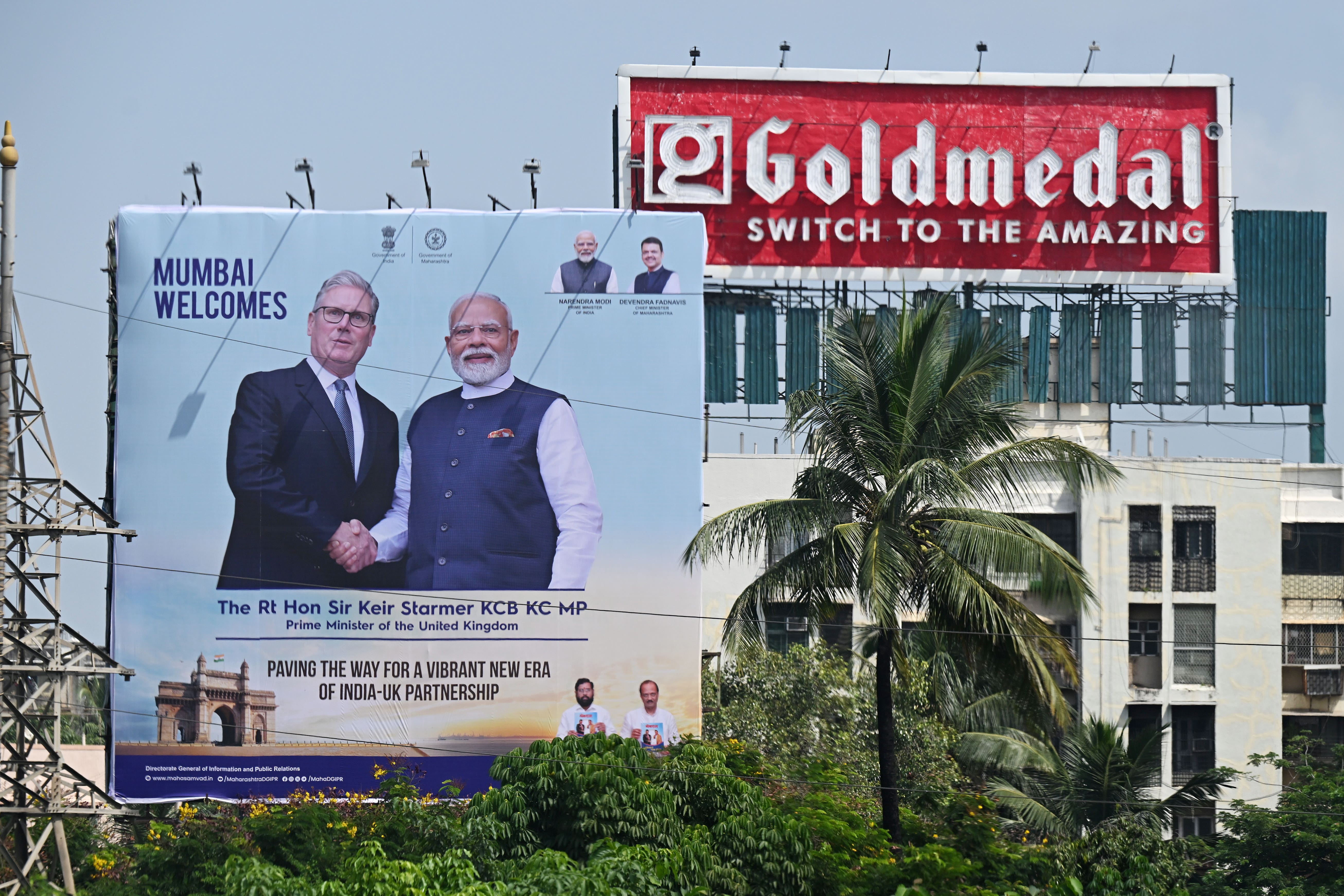 A billboard of Indian Prime Minister Narendra Modi welcoming Prime Minister Sir Keir Starmer is seen on a street in Mumbai