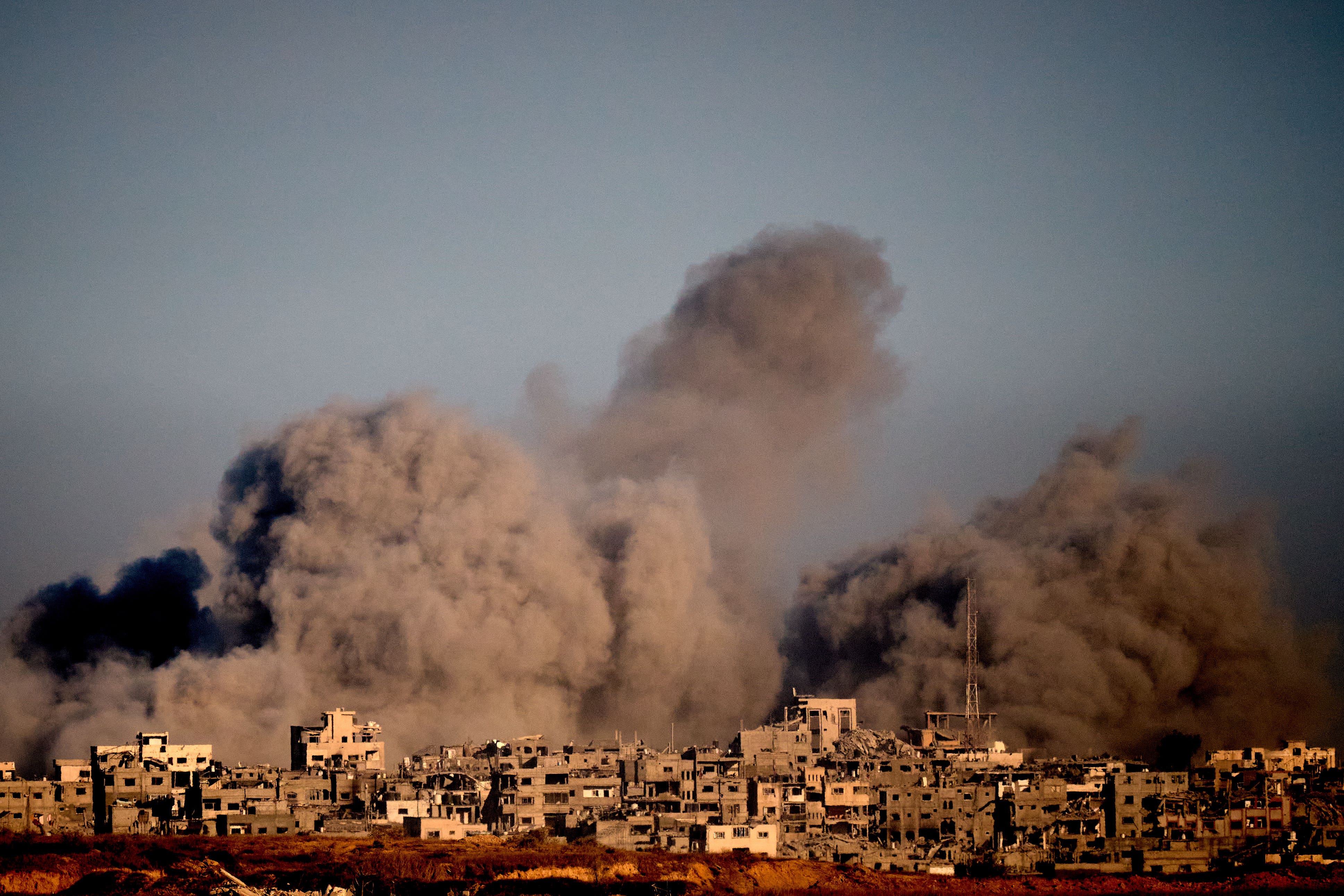 Smoke rises following an Israeli military strike in the northern Gaza Strip, seen from southern Israel, on 8 October