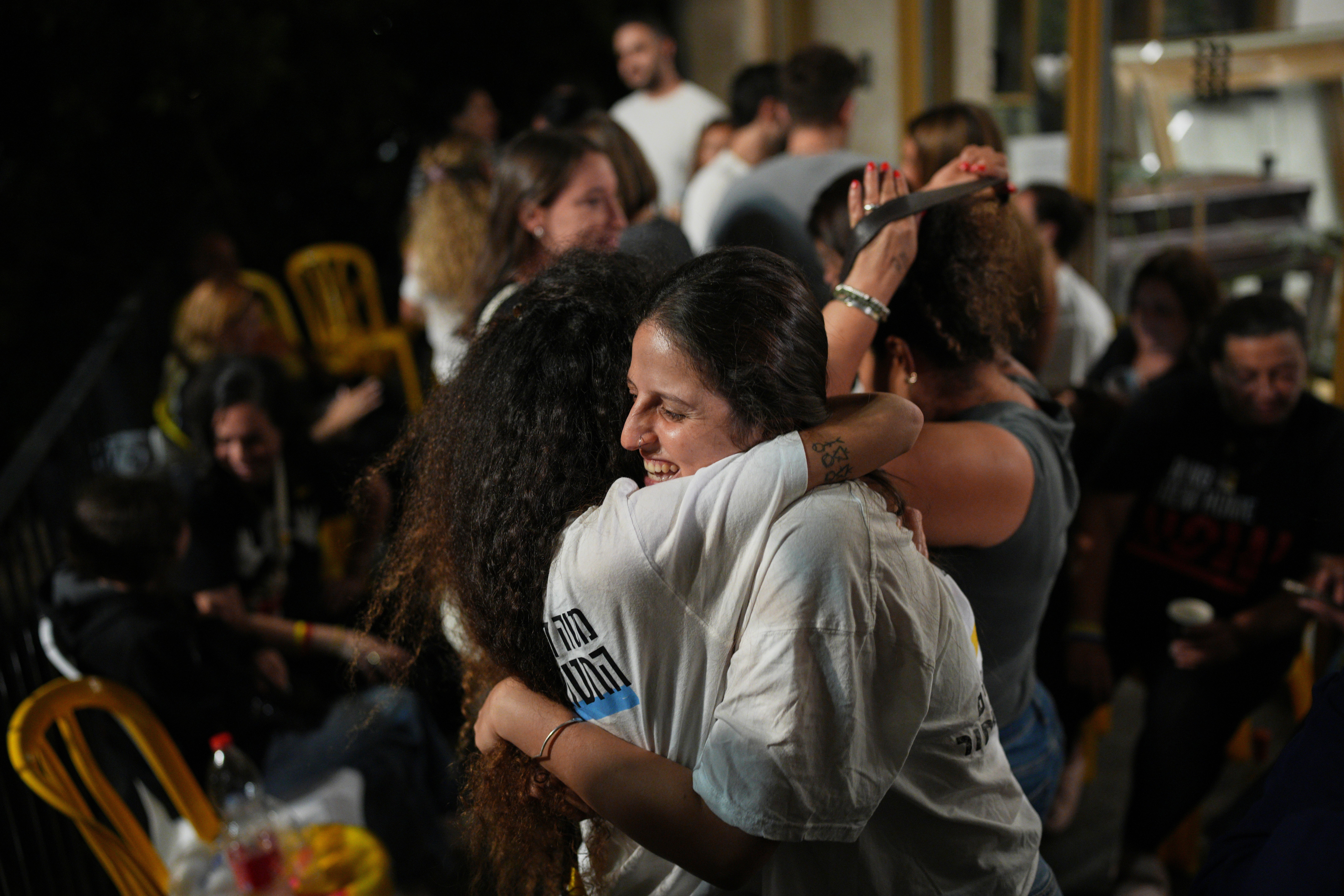 Hostage families and supporters celebrate the announcement of the ceasefire at the ‘Hostages Square’ plaza in Tel Aviv, Israel