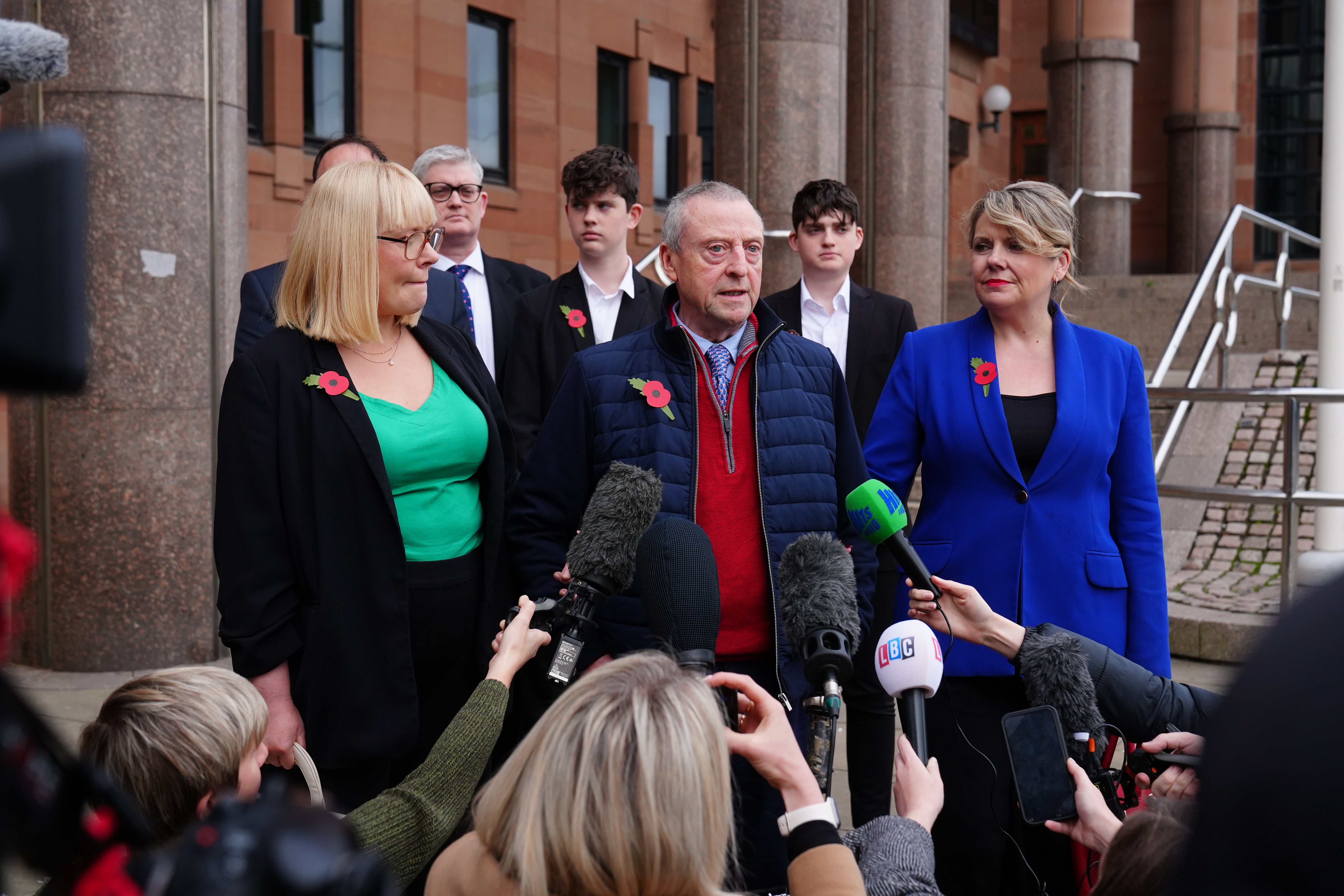 Patrick O’Hara (centre) speaking to the media after the sentencing for Thomas Kwan in November 2024