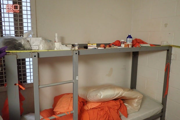 A photo of Epstein’s cell bunk shows his personal items lined up on the top of his bunk and an excessive amount of linens strewn about the bottom bunk