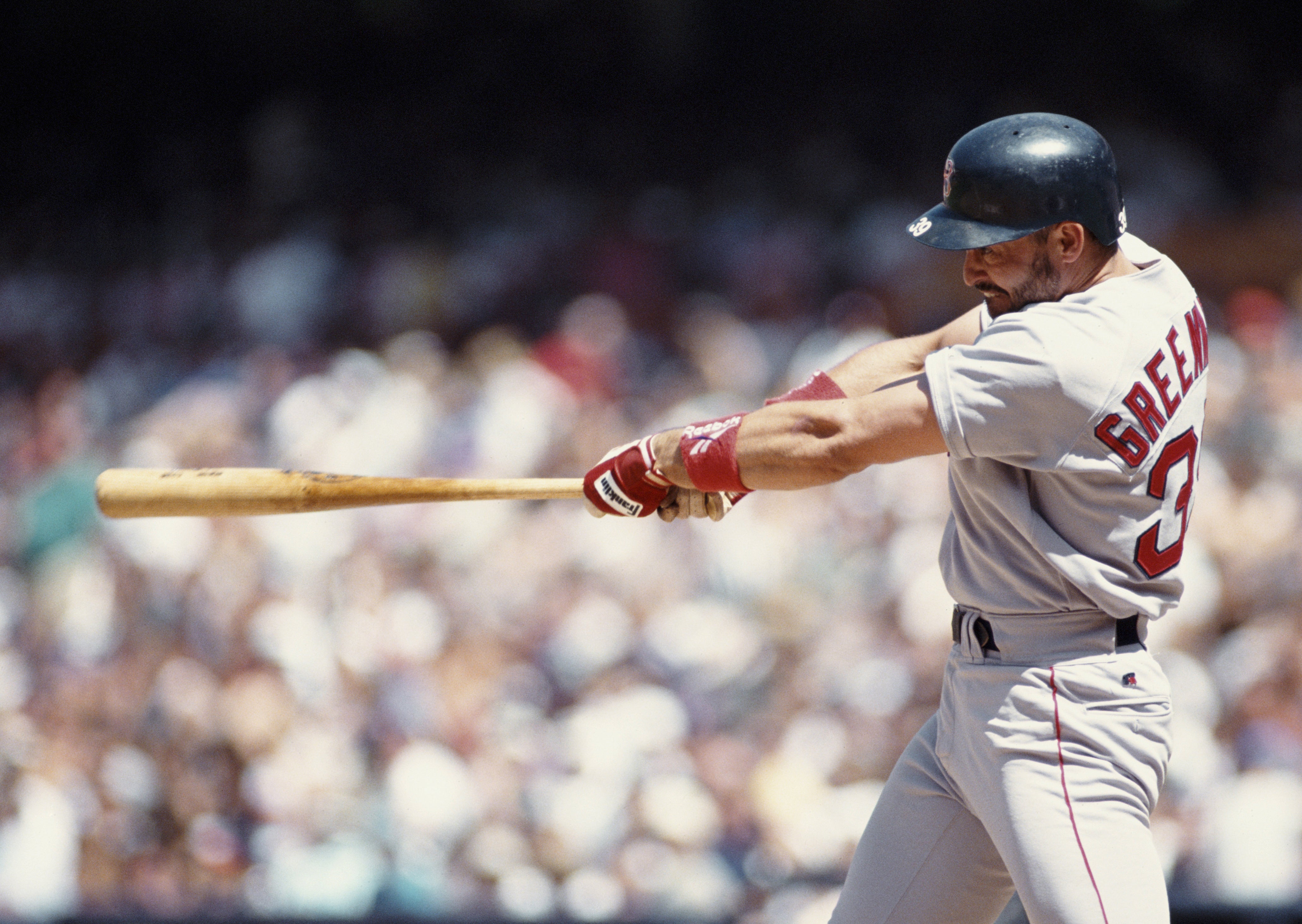 Mike Greenwell, Leftfielder for the Boston Red Sox swings at the ball