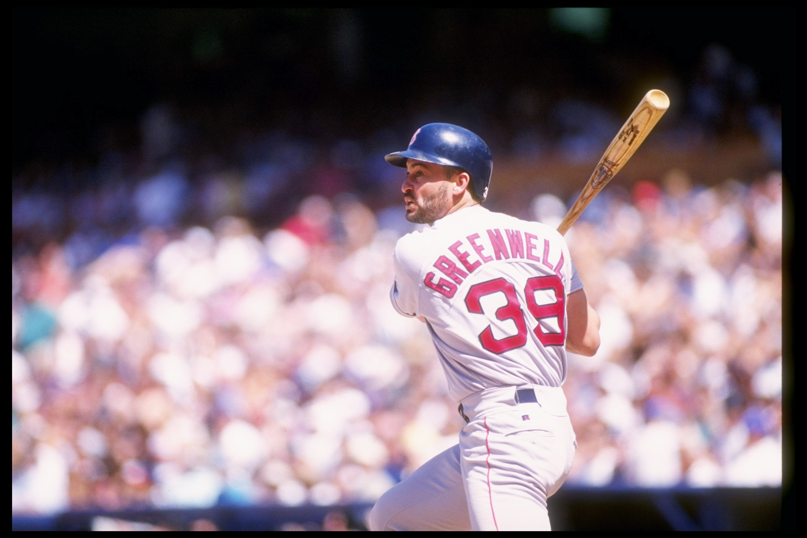 Outfielder Mike Greenwell of the Boston Red Sox takes his turn at bat during a game against the California Angels in 1993