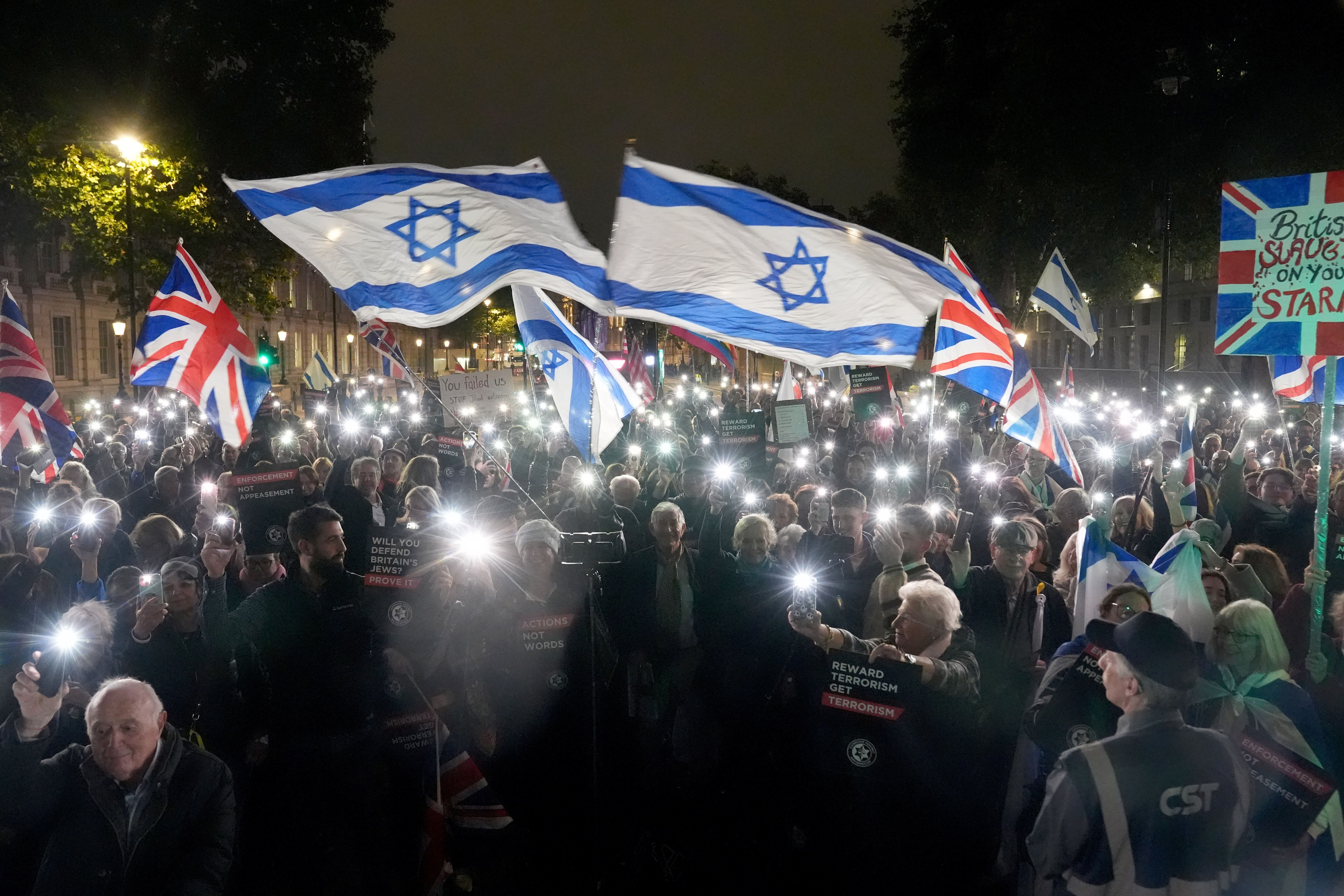 People take part in a demonstration outside Downing Street, Westminster, organised by the Campaign Against Antisemitism (Lucy North/PA)