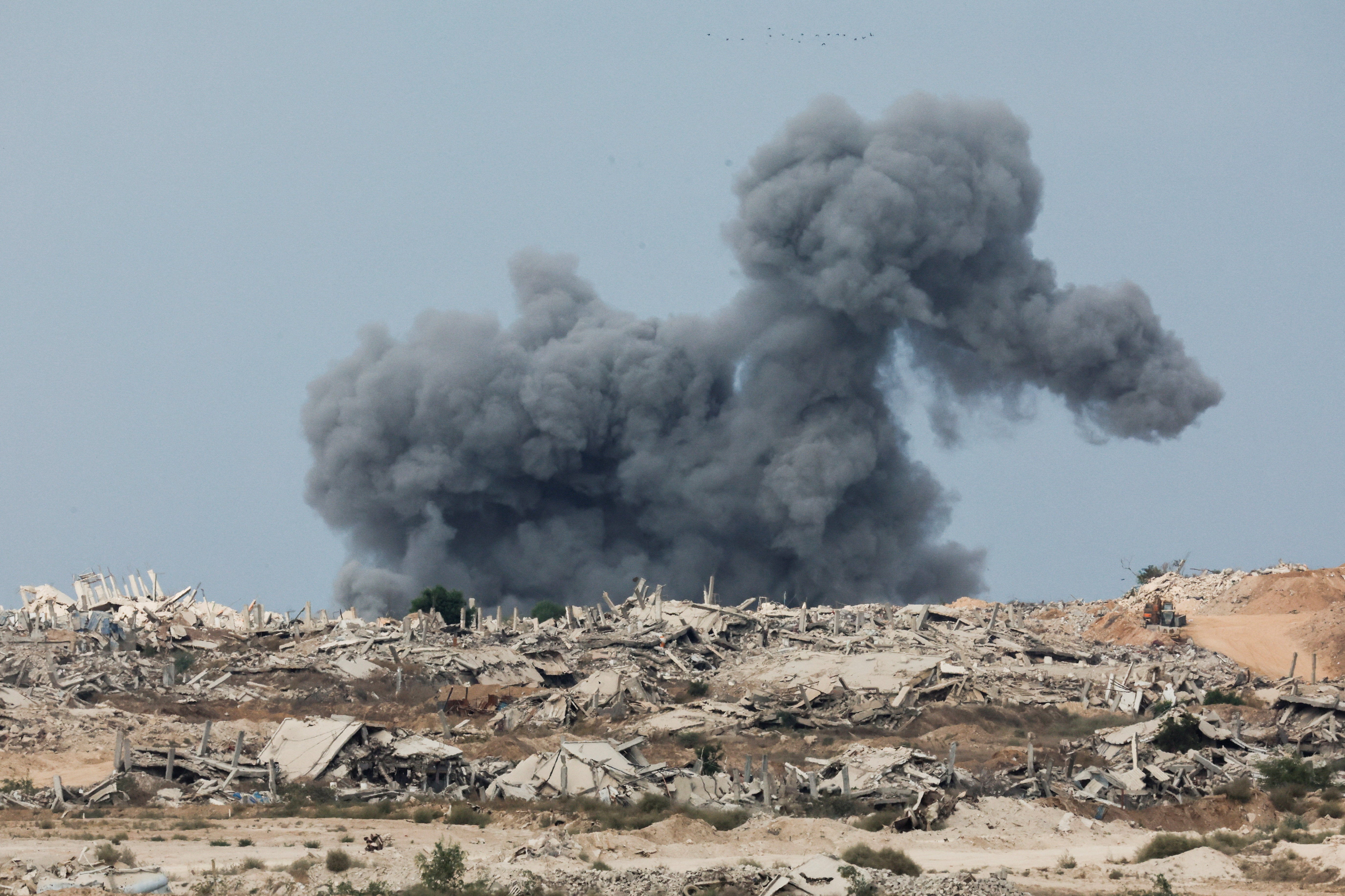 Smoke rises above the Gaza skyline on Thursday morning even after Trump announced that Israel and Hamas had agreed on the first phase of a ceasefire deal