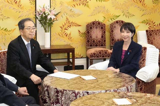 <p>Sanae Takaichi, right, of Japan's ruling LDP with Tetsuo Saito of Komeito pose for a photo before their talks at the parliament in Tokyo</p>