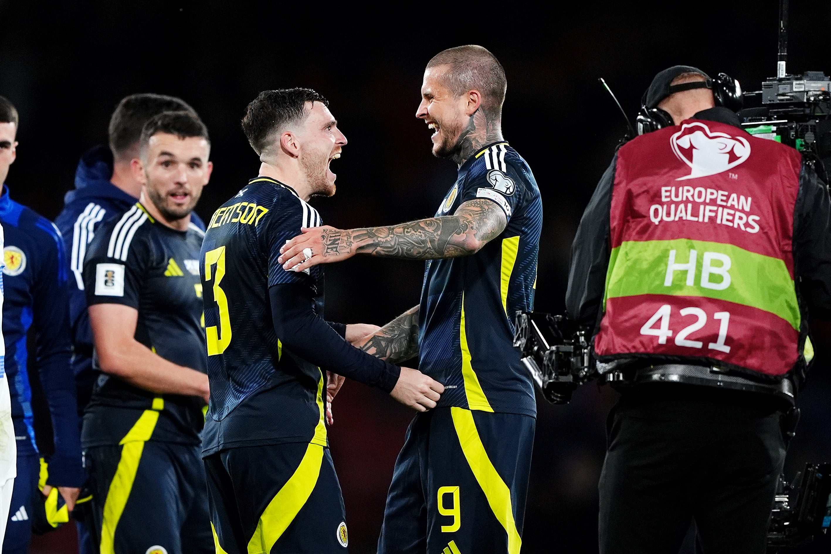 Andy Robertson celebrates with Lyndon Dykes after Scotland’s 3-1 win