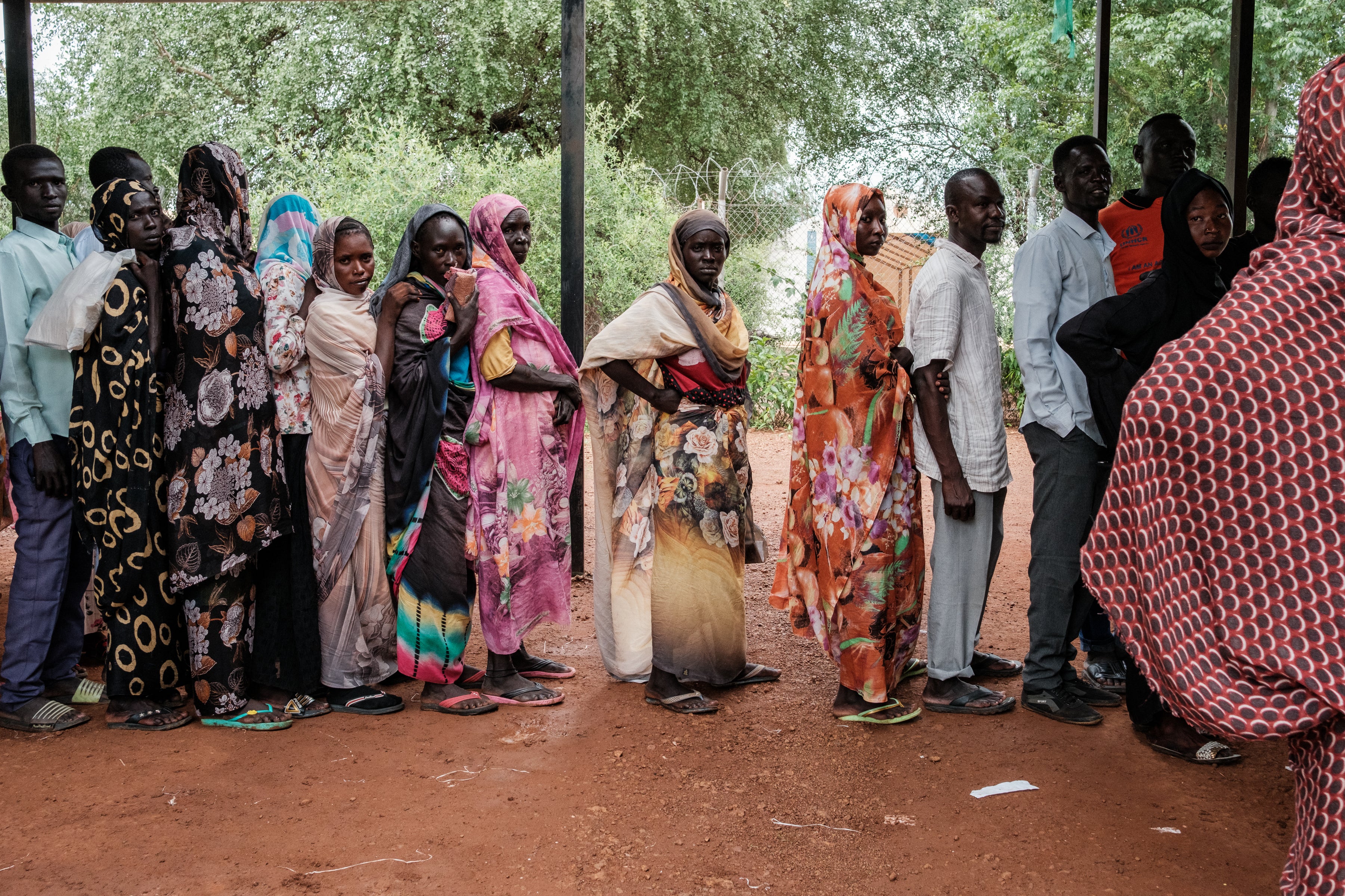 People line up to receive aid at a refugee camp in Maban, South Sudan