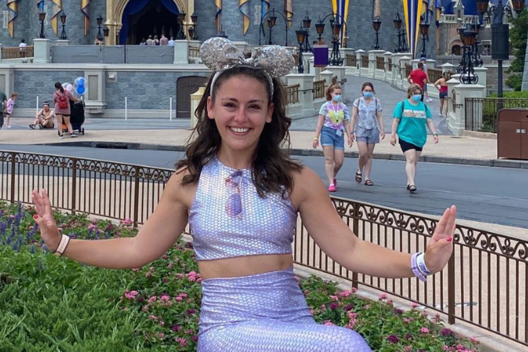 Former Disney Cruise Line cast member Caitlin Hornik, seen at Disney World in 2021, reacts to Disney's latest price hikes