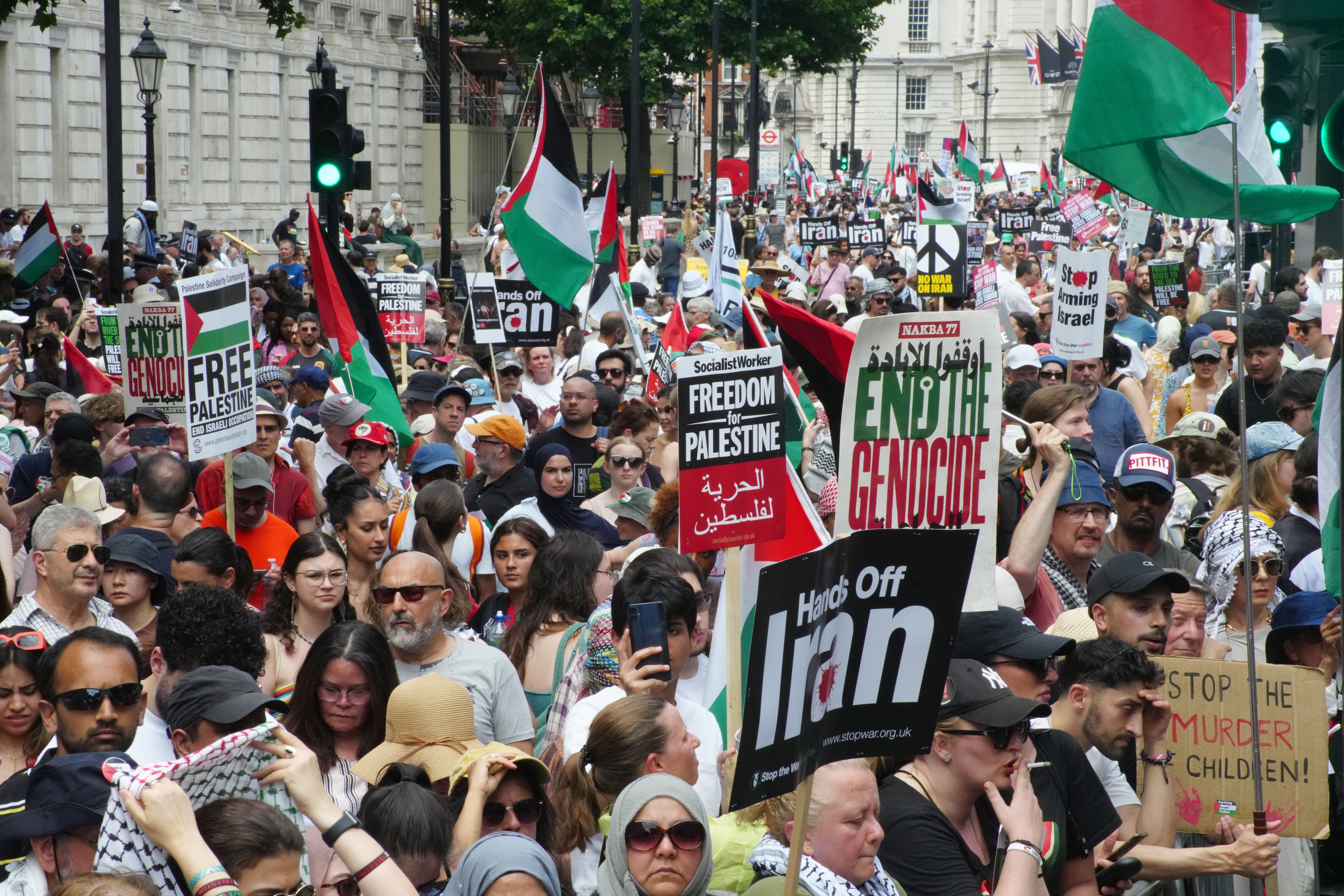 People take part in a march organised by the Palestine Solidarity Campaign (PA)