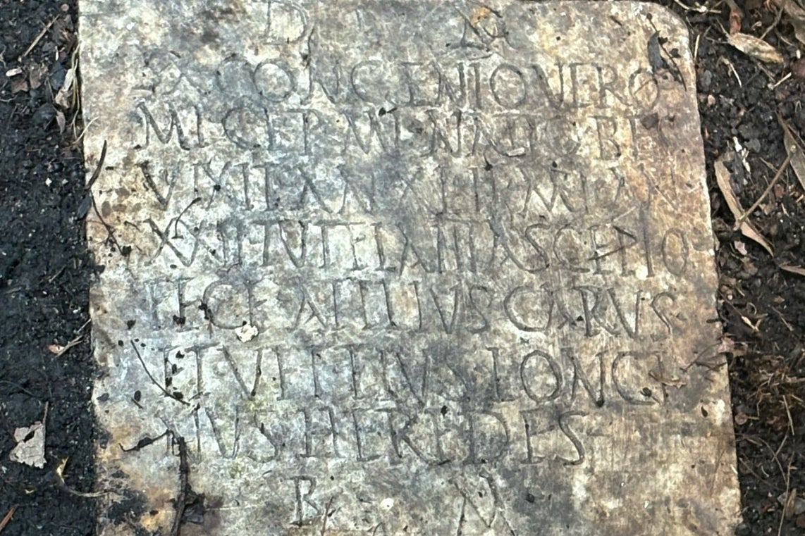 <p>A Latin inscription on the 1,900-year-old grave marker of a Roman sailor named Sextus Congenius Verus, discovered in a New Orleans backyard</p>