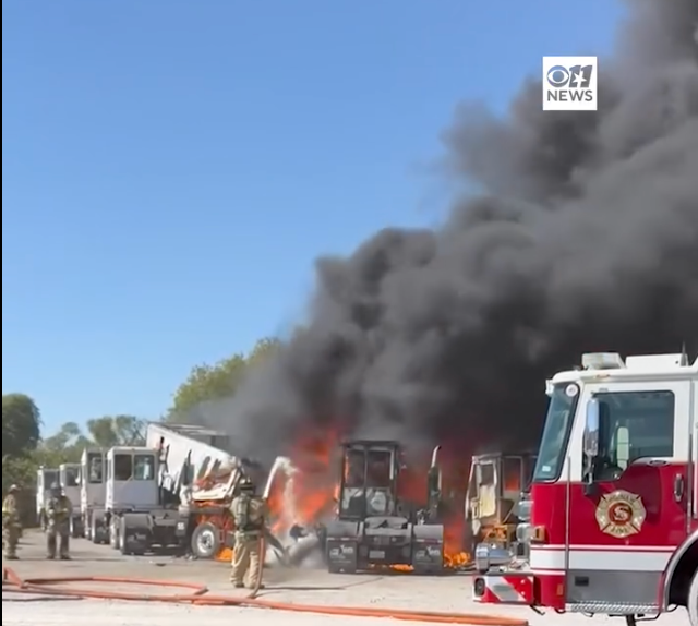 Firefighters work to battle the flames from a plane crash near Hicks Airfield in Tarrant County, Texas