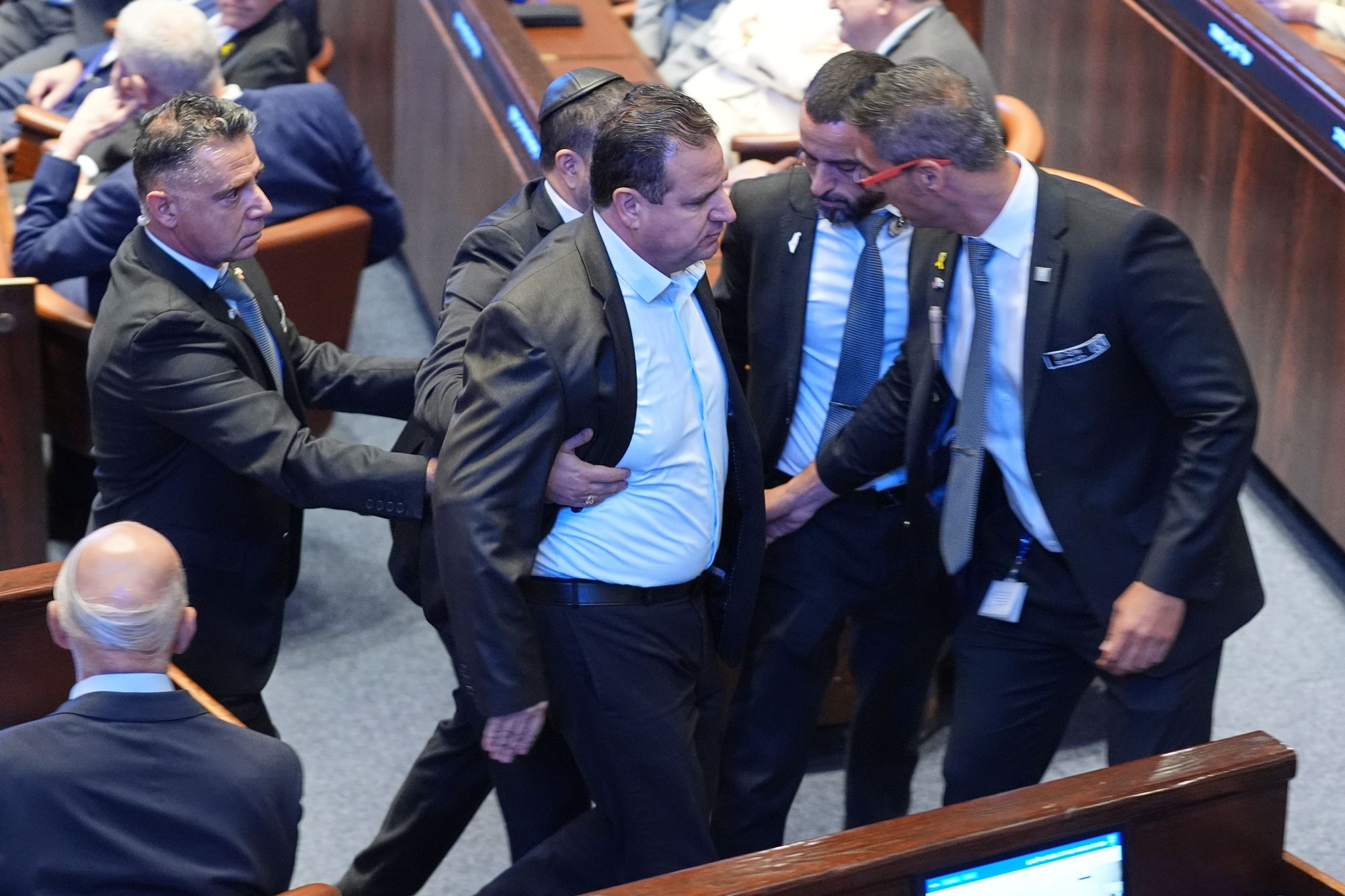 Security officials remove a Knesset member who interrupted Trump’s speech