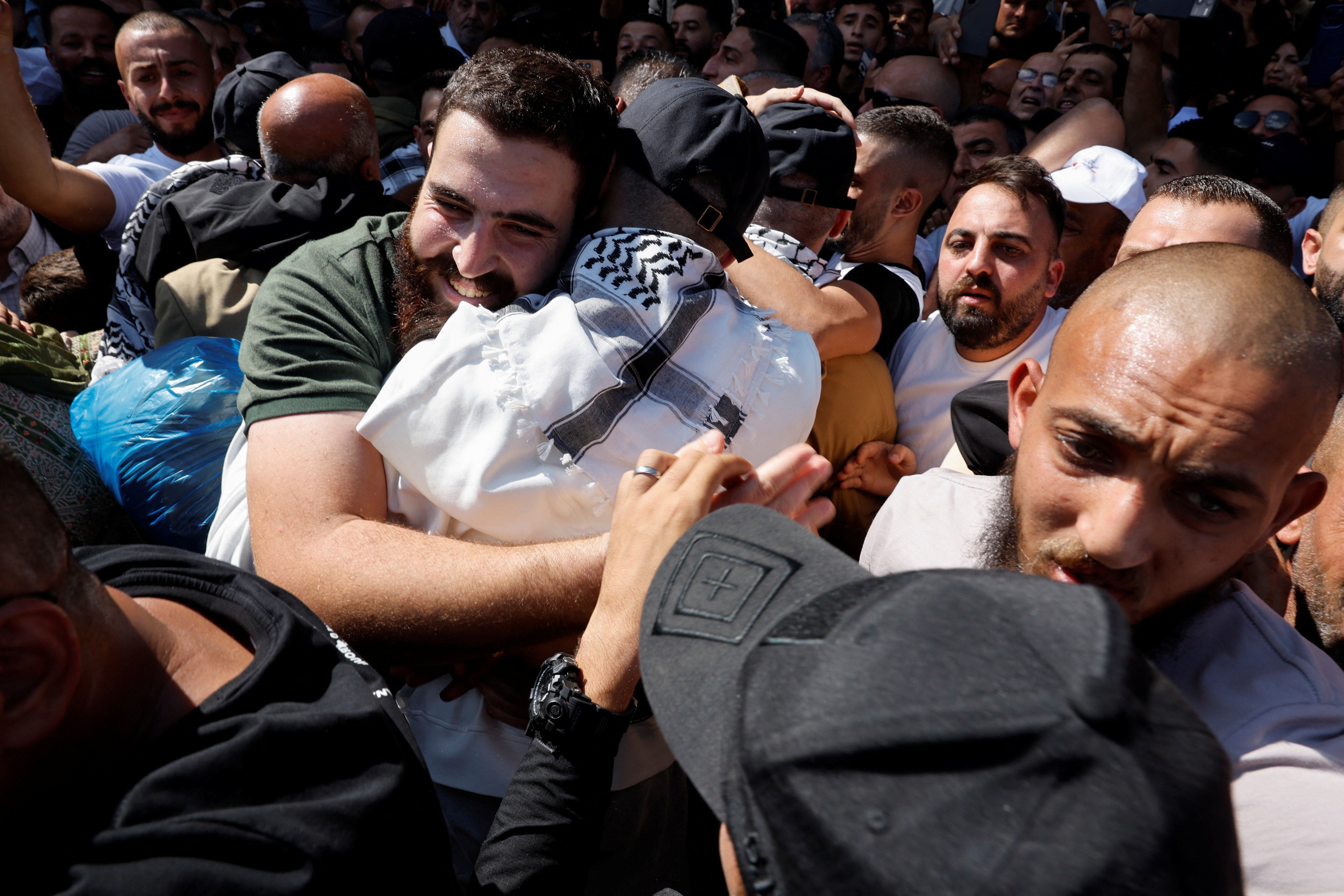A freed Palestinian man is greeted by friends and relatives in Ramallah