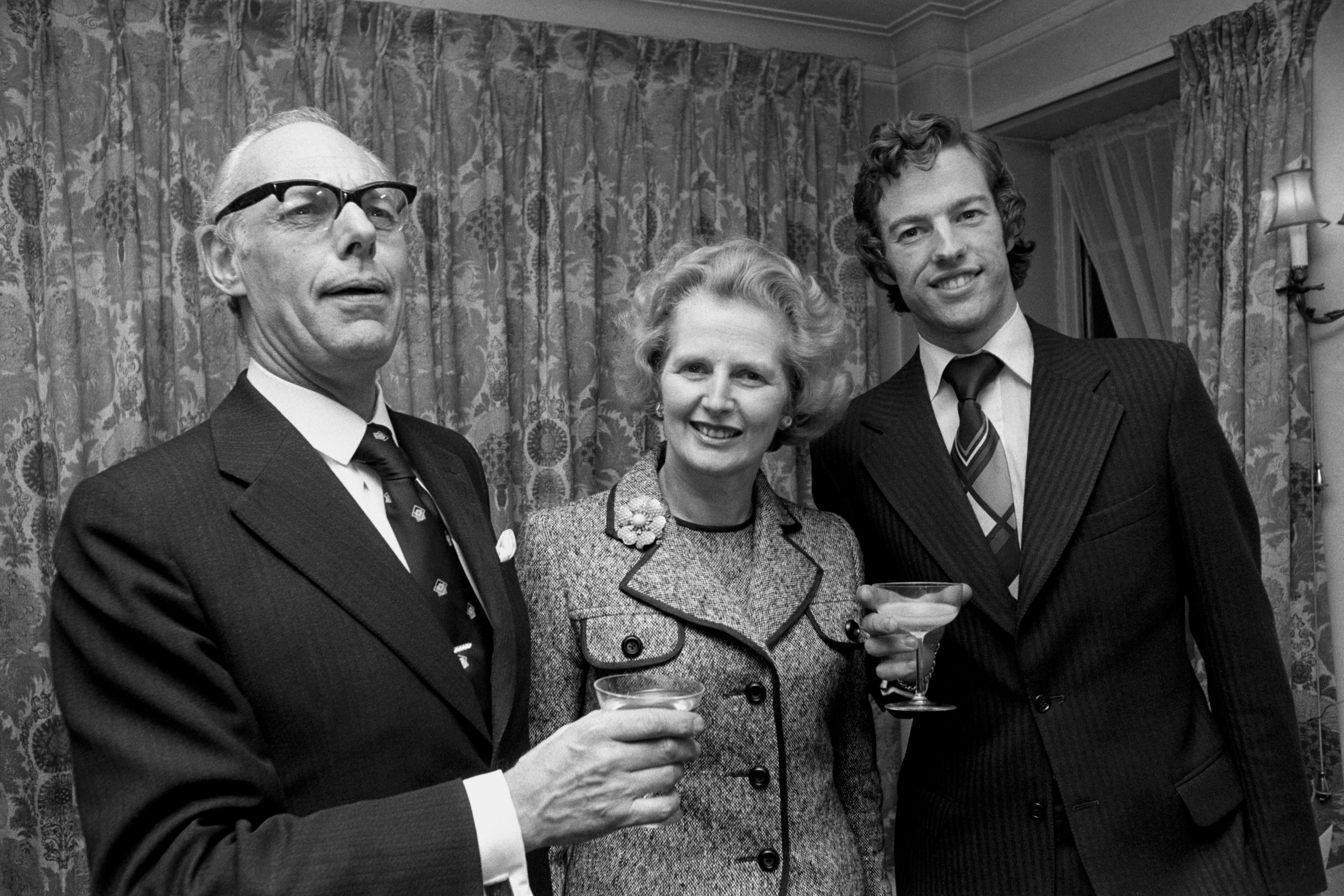 Margaret Thatcher celebrates with husband Denis and son Mark following her success in the first round of the election for the Conservative Party leadership