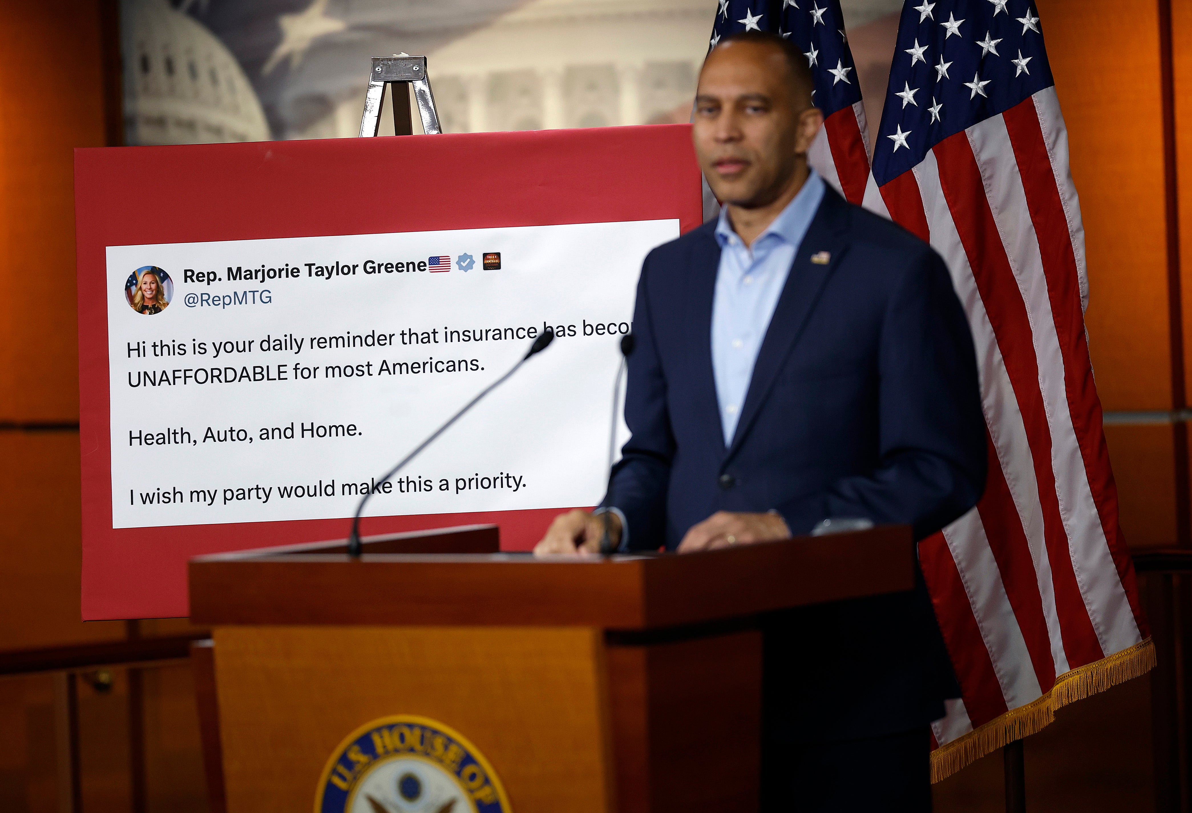 House Minority Leader Hakeem Jeffries shows a tweet by Rep. Marjorie Taylor Greene at a press conference during the government shutdown as both parties argue over healthcare subsidies