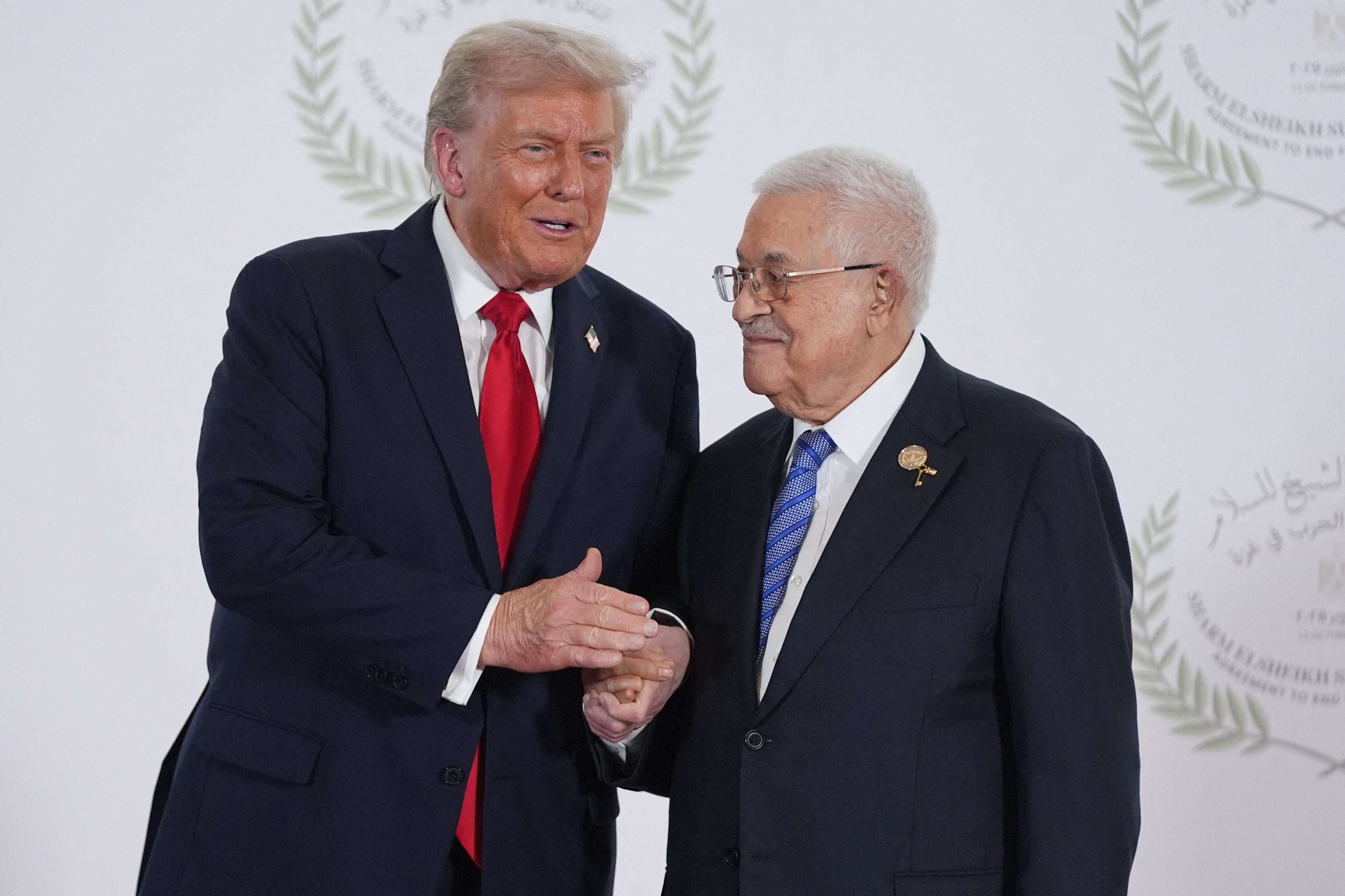Donald Trump greets Mahmoud Abbas, leader of the Palestinian Authority, during a summit on Gaza in Sharm el-Sheikh on Monday