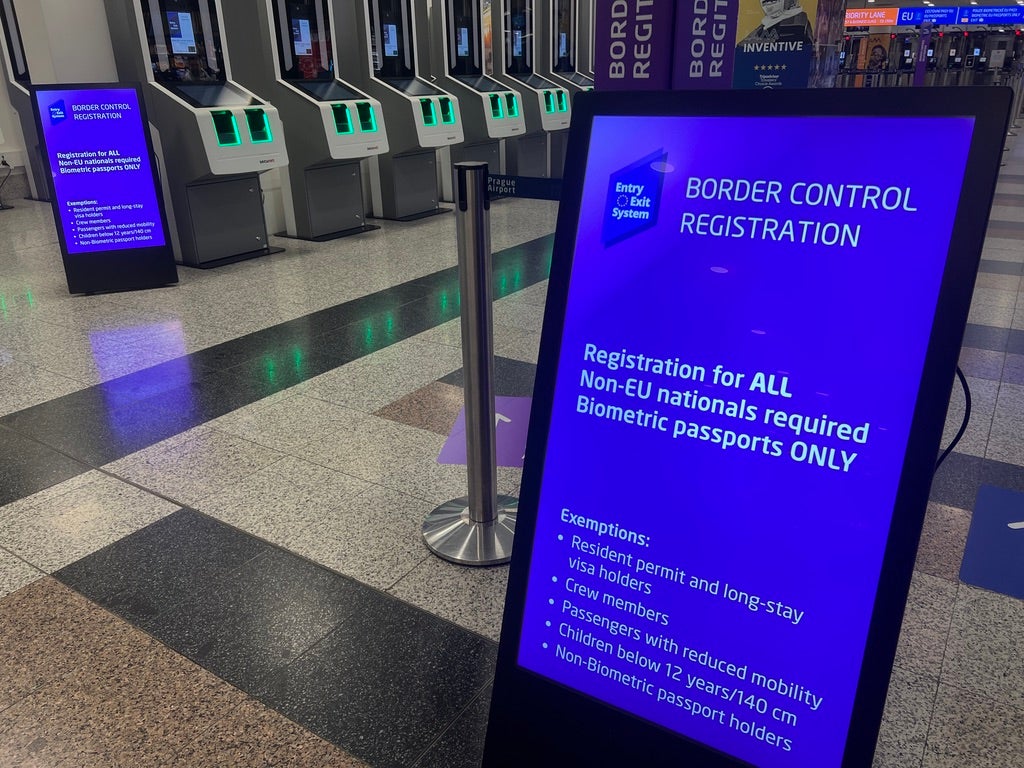 On the border: Signs directing non-EU nationals to entry-exit system kiosks at Prague airport