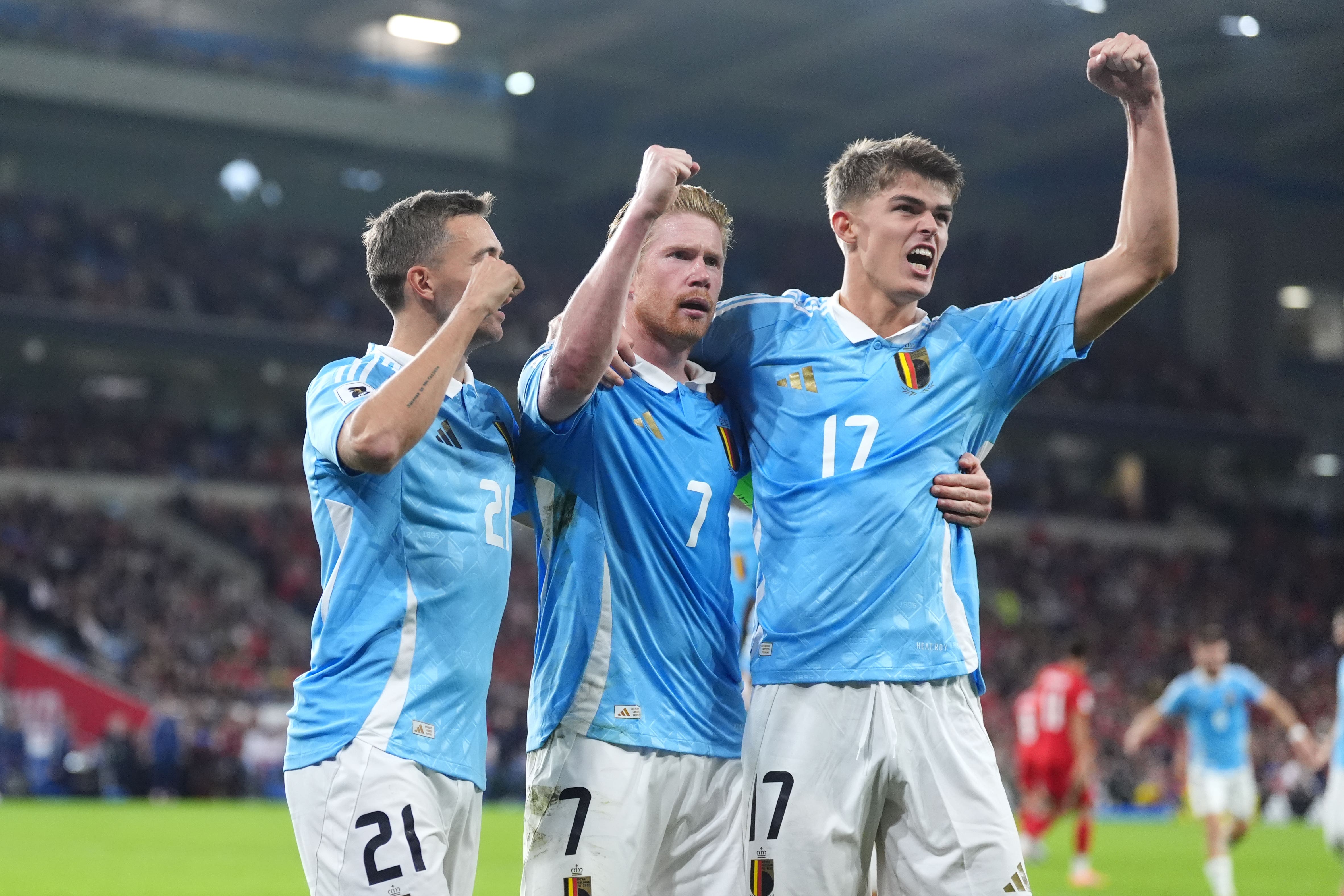 Kevin De Bruyne (centre) celebrates scoring Belgium’s third goal against Wales