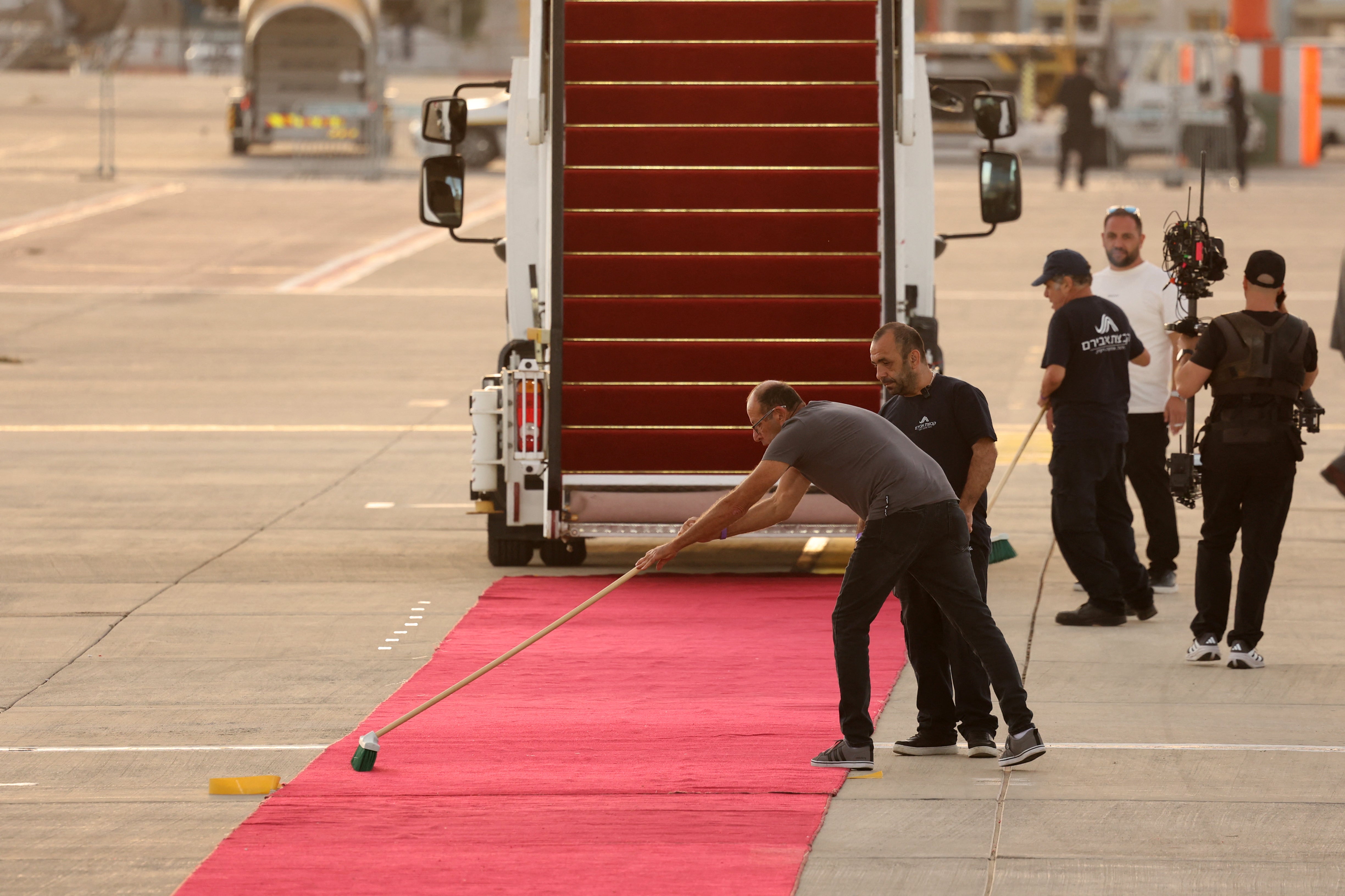 Israeli airport staff prepare the Red Carpet ahead of US President Donald Trump's arrival at Ben Gurion Airport