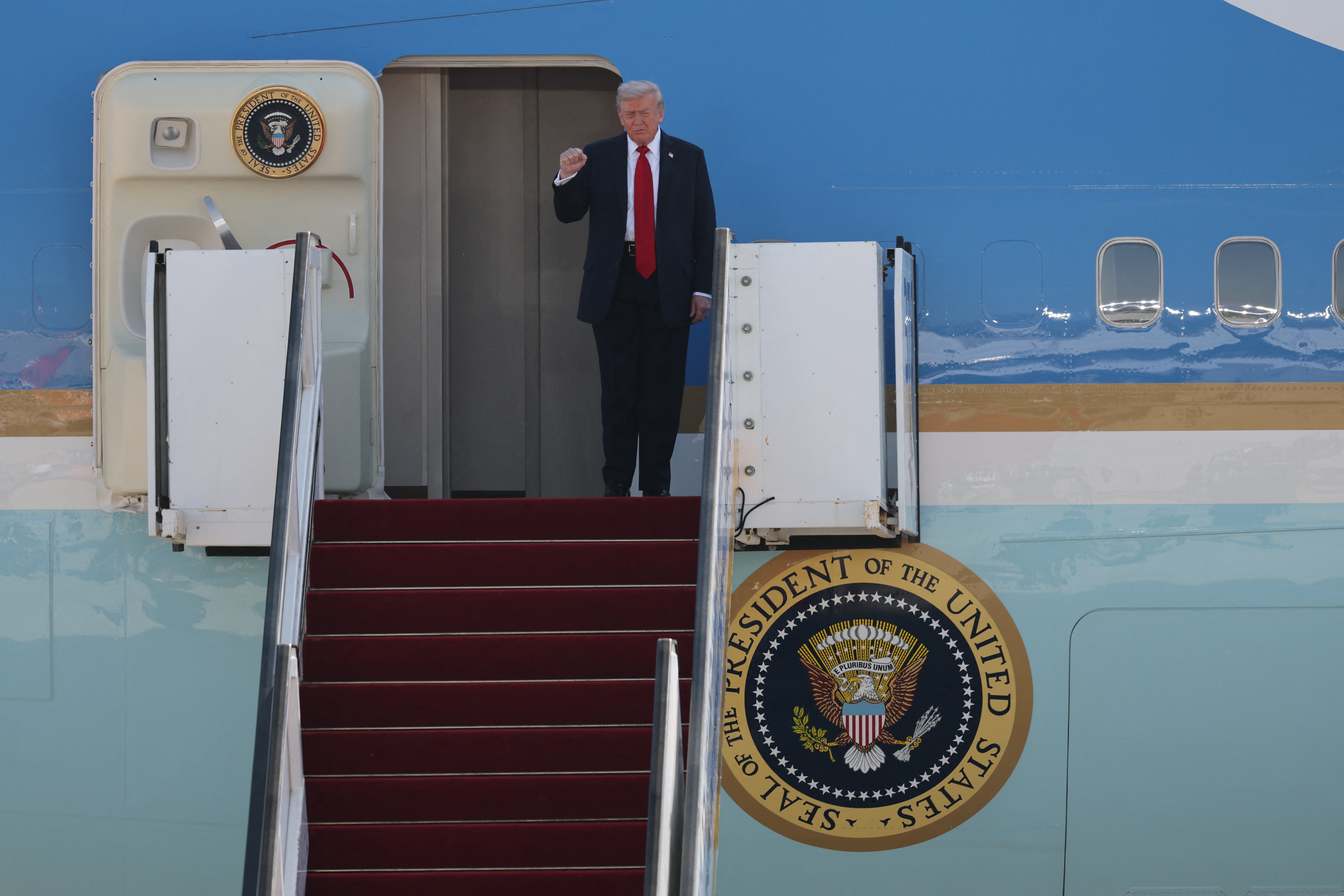 Donald Trump gestures after touching down at Ben Gurion airport on Monday