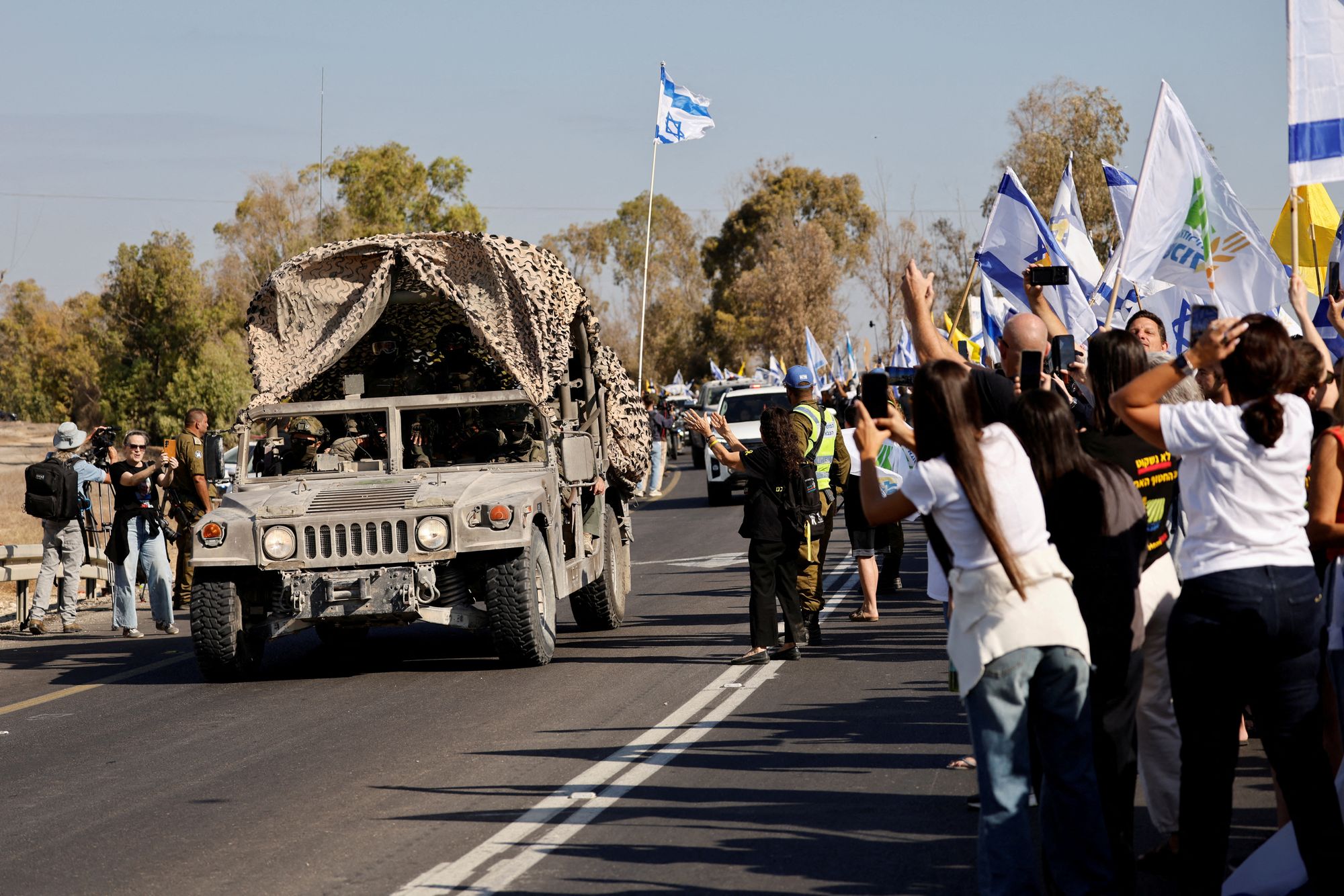 A convoy carrying released Israeli hostages after their retrieval from Gaza