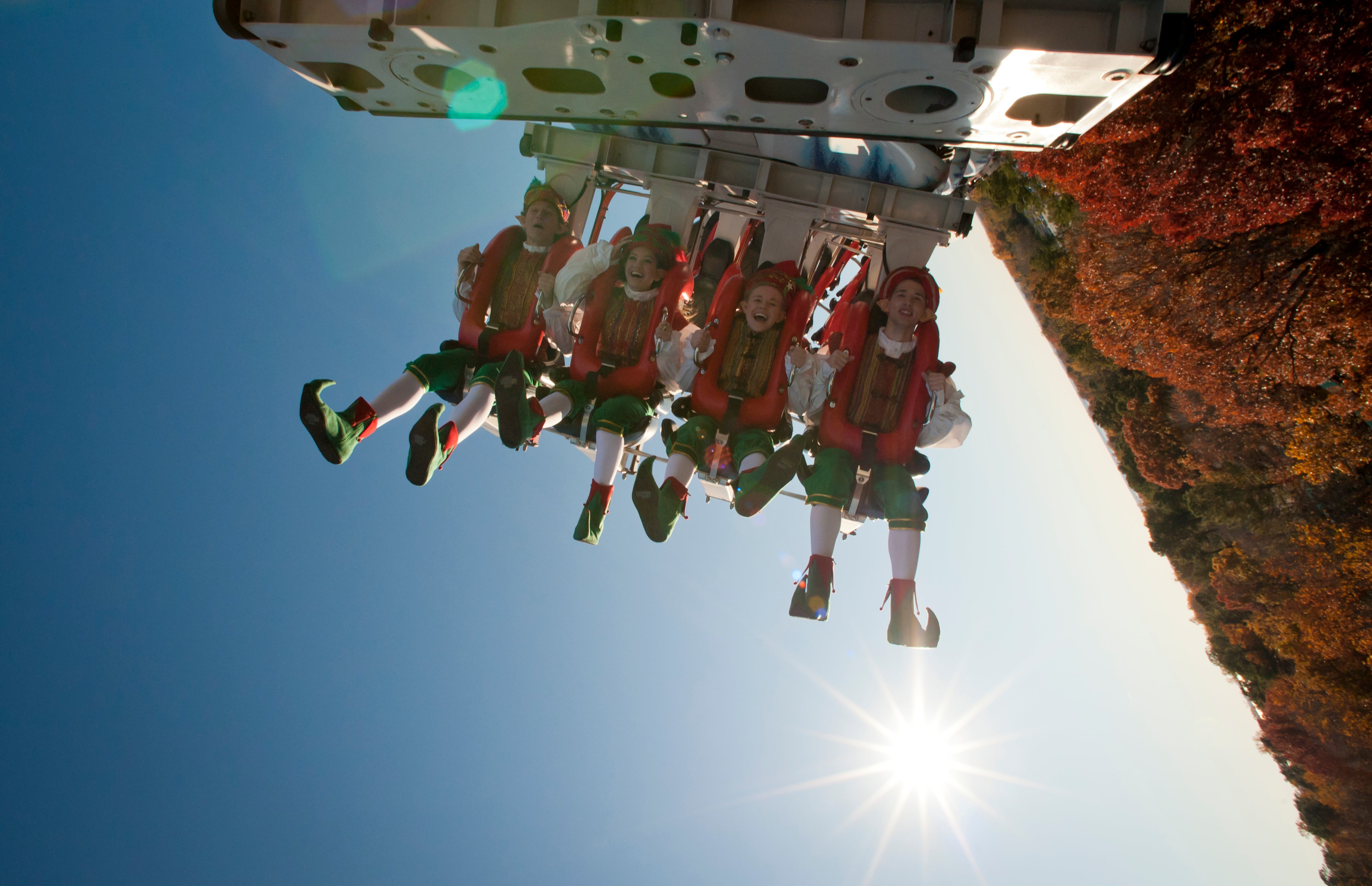 Costumed park workers ride a new rollercoaster at Busch Gardens Williamsburg in Virginia, 2011