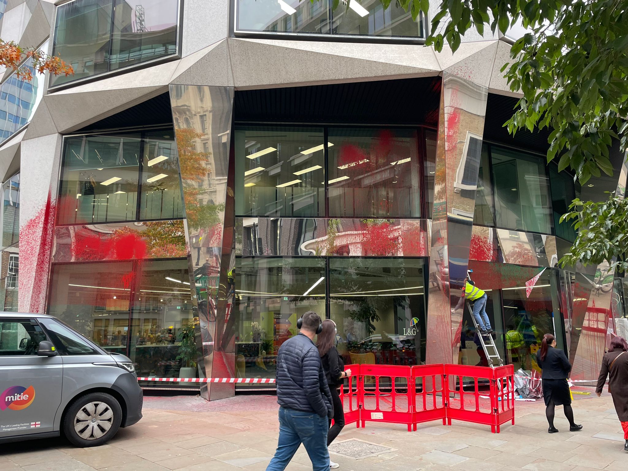 The headquarters of the international insurance and asset management group was covered with red paint