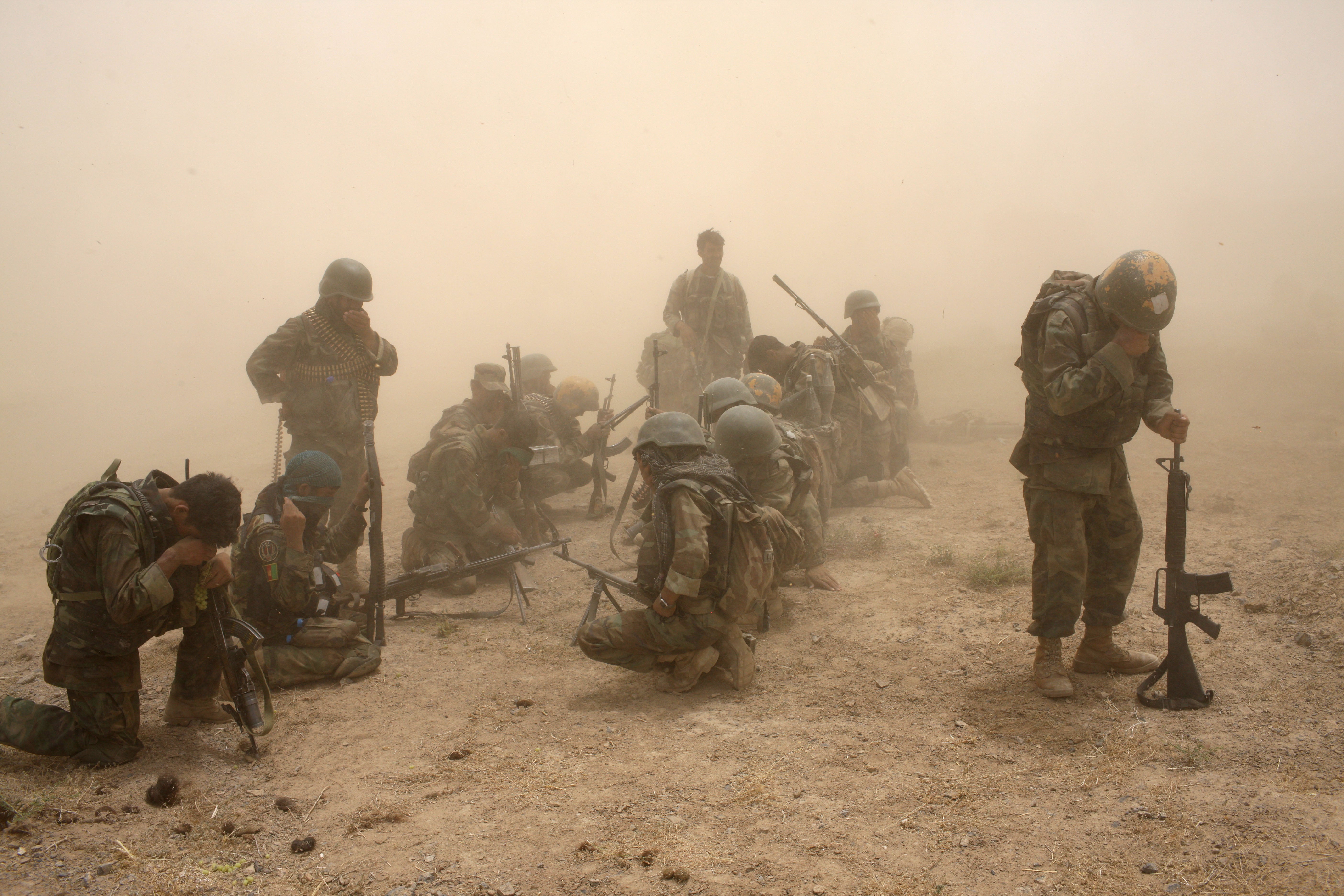 Members of the Afghan security forces wait to be extracted by helicopter after a 2008 operation in Afghanistan