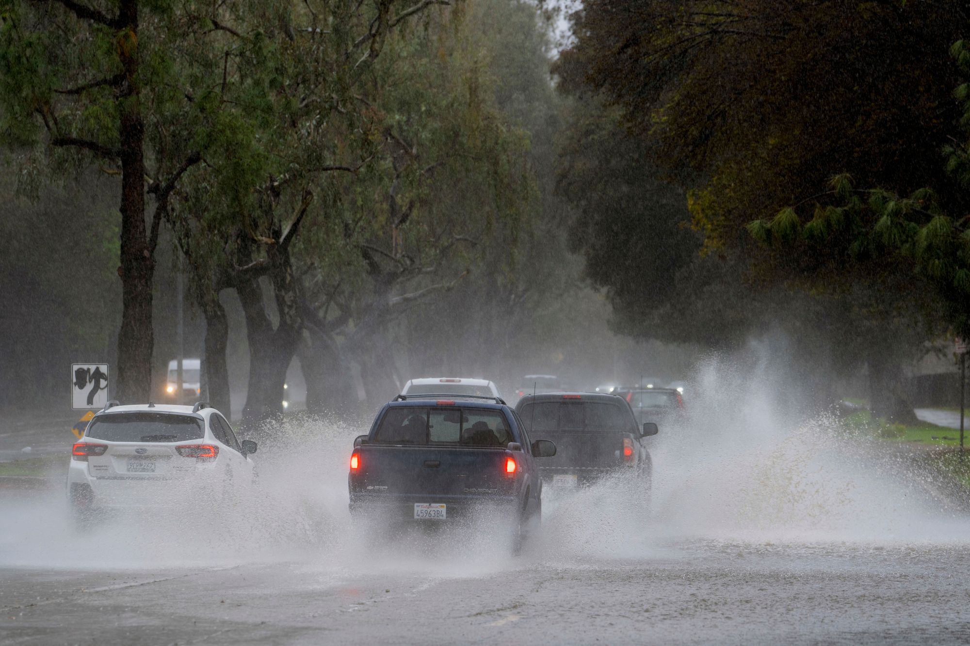 <p>Cars drive through flooded Los Angeles</p>