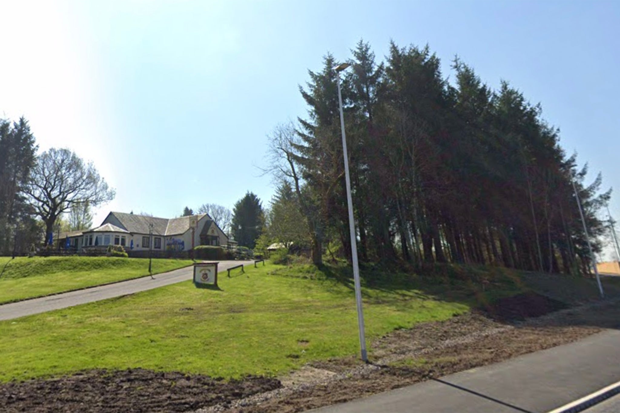 Trees in front of a building, which now houses The Osprey, which the restaurant owners cut down as seen from the A726