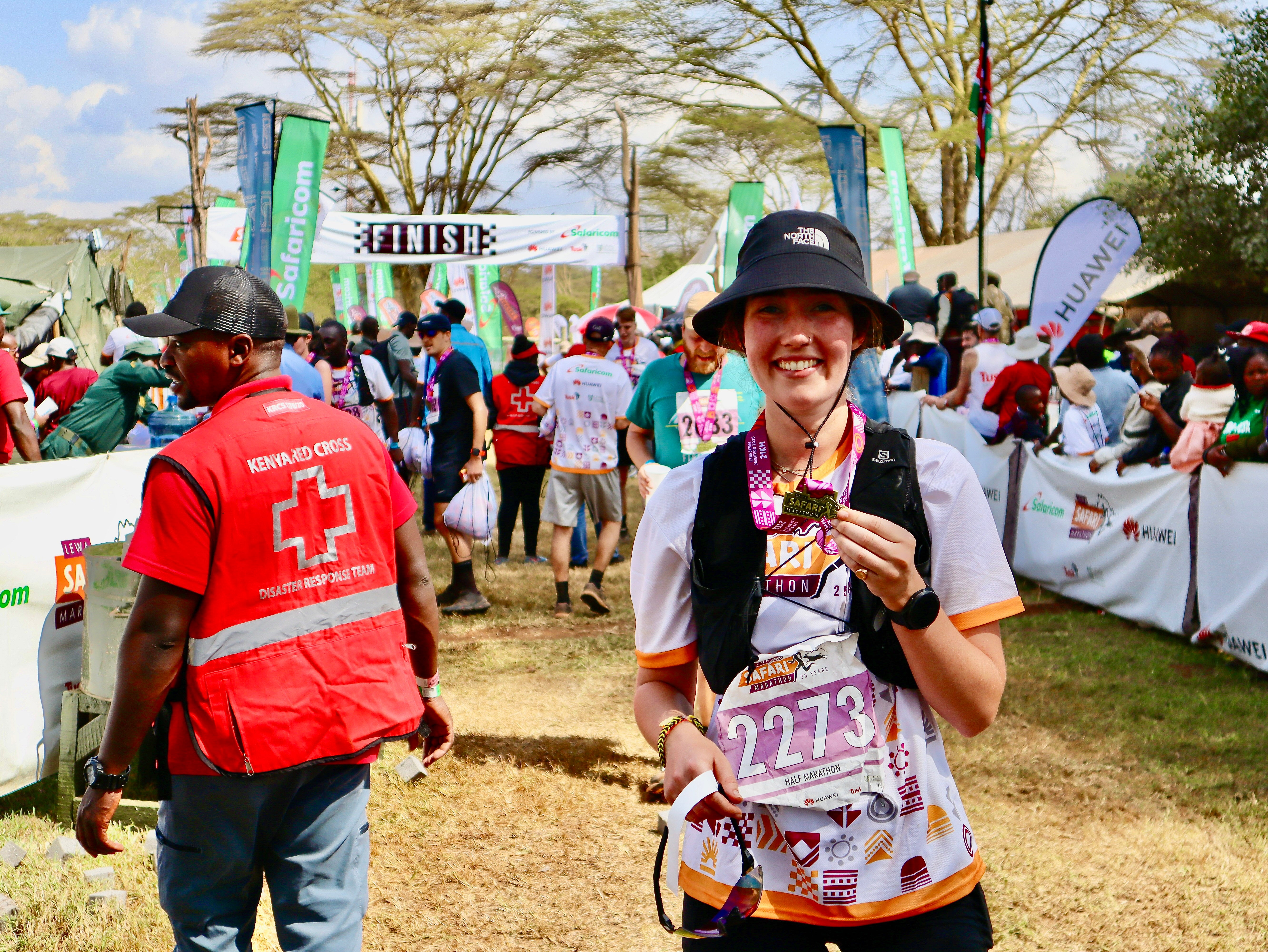 Isabella pictured with a medal at the finish line