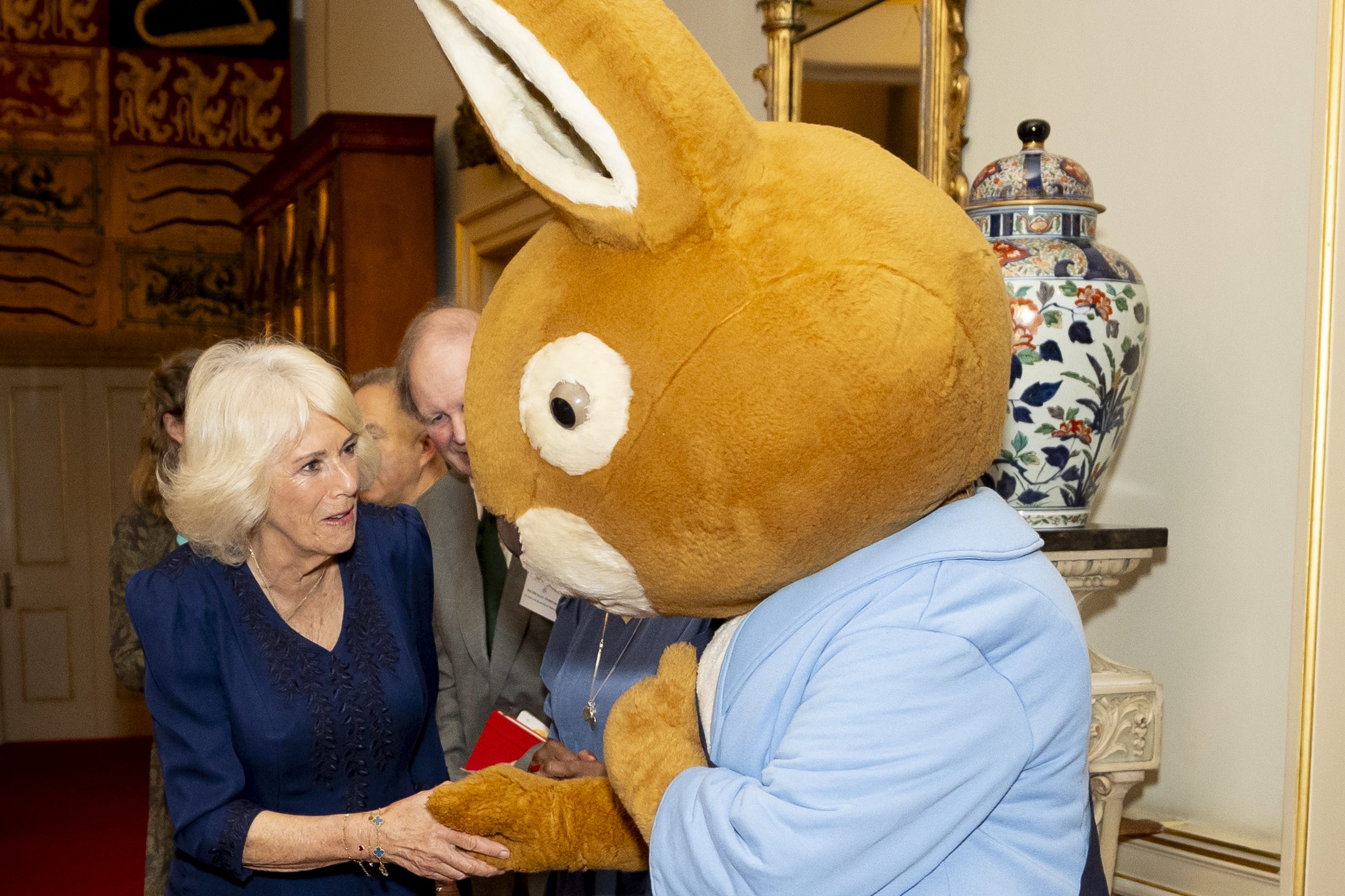 Queen Camilla with Peter Rabbit during a reception to celebrate the centenary of BookTrust, at Clarence House, London (Aaron Chown / PA).