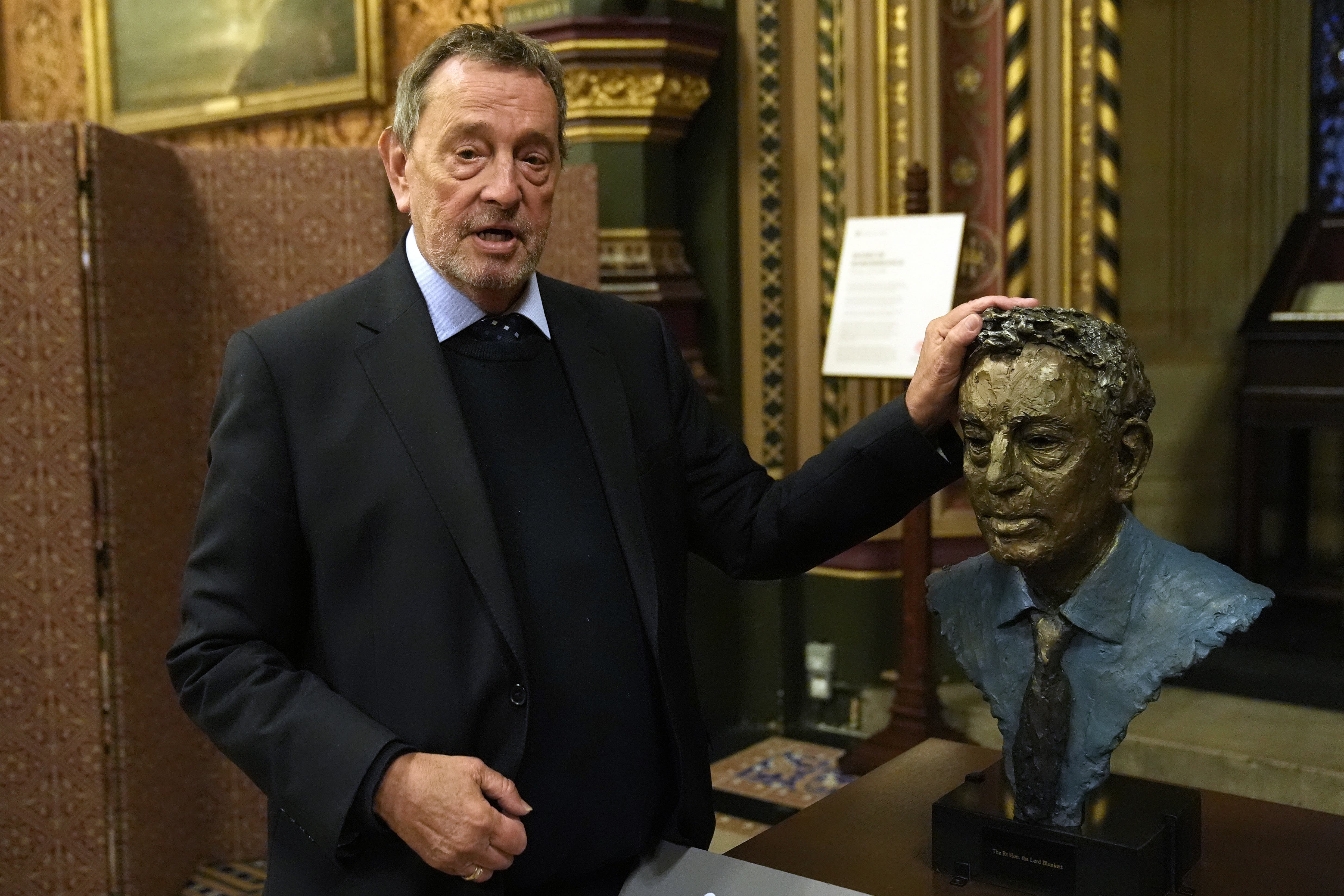 Lord David Blunkett with a bronze bust of himself at the House of Lords (Stefan Rousseau/PA)