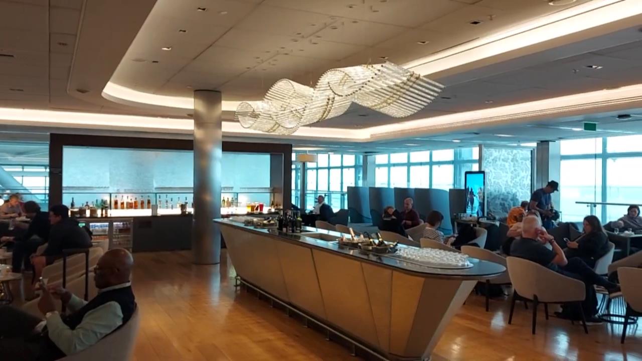 Ted stops by at Galleries Club Lounge South for a coffee and a pastry before his flight