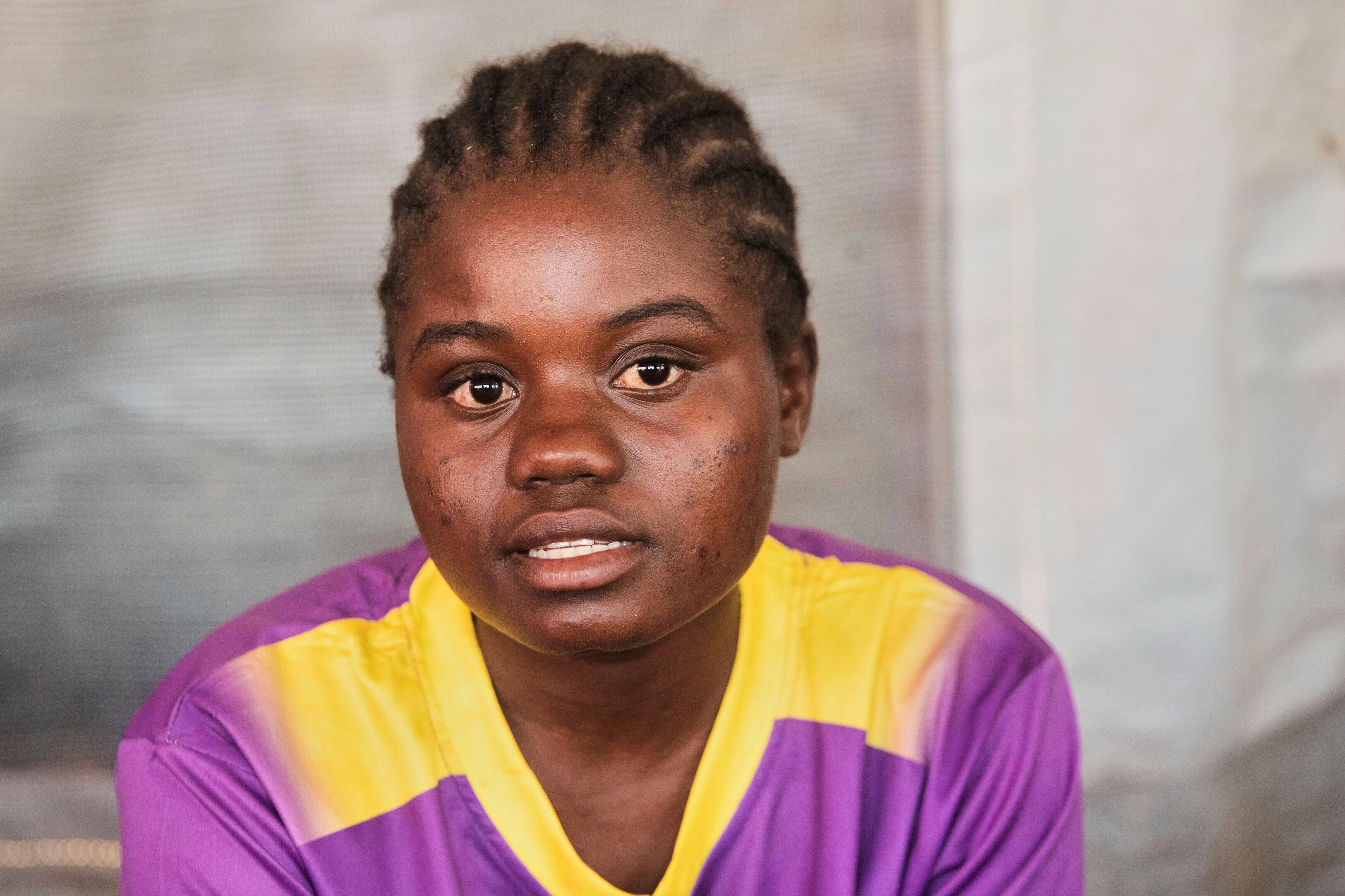 Anita Razo, a 18-year-old girl speaks to the Associated Press, in Shamva, Zimbabwe, Friday, Aug. 29, 2025. (AP Photo/Aaron Ufumeli)