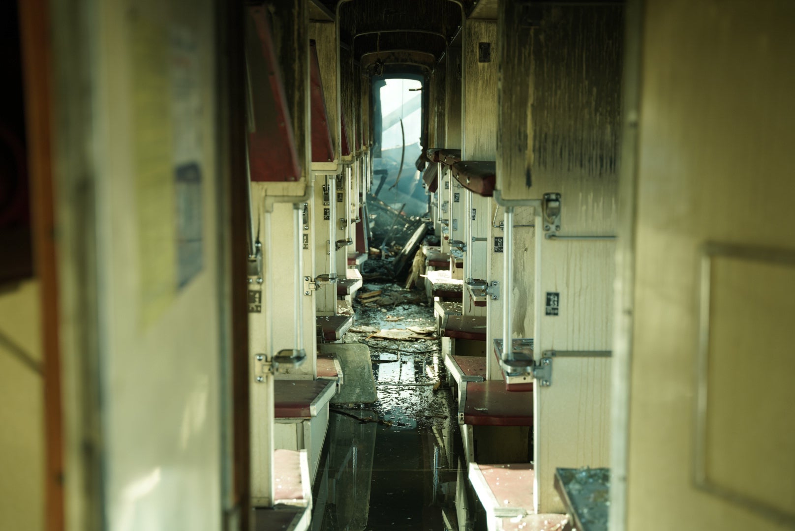 A passenger train is seen damaged following Russia's drone attack on a railway station in Shostka, Sumy region, Ukraine, Saturday, Oct. 4, 2025. (AP Photo/Kordon Media)