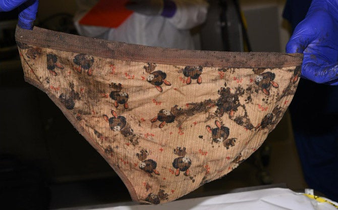Underwear found at the scene where a baby’s body was discovered in a field nearly a year ago