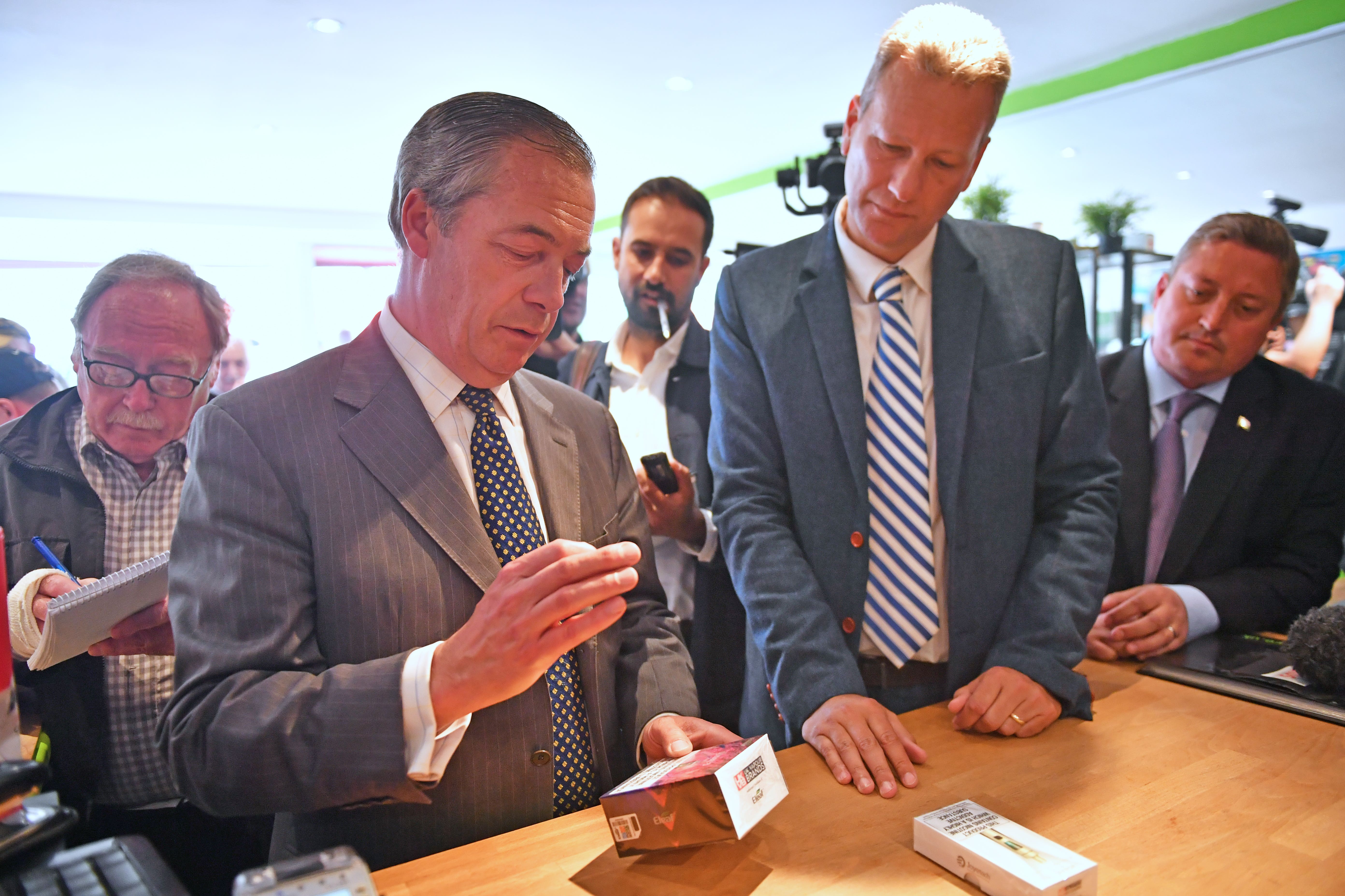 Nigel Farage, left, with Nathan Gill (PA)