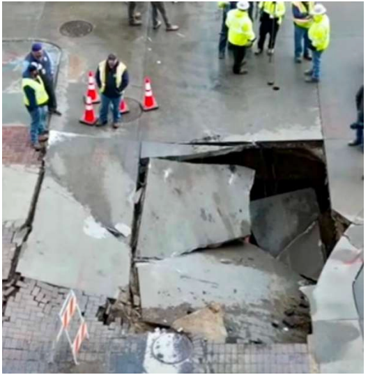 The sinkhole, in downtown Omaha, pictured in the lawsuit filed by Lisa Kilker