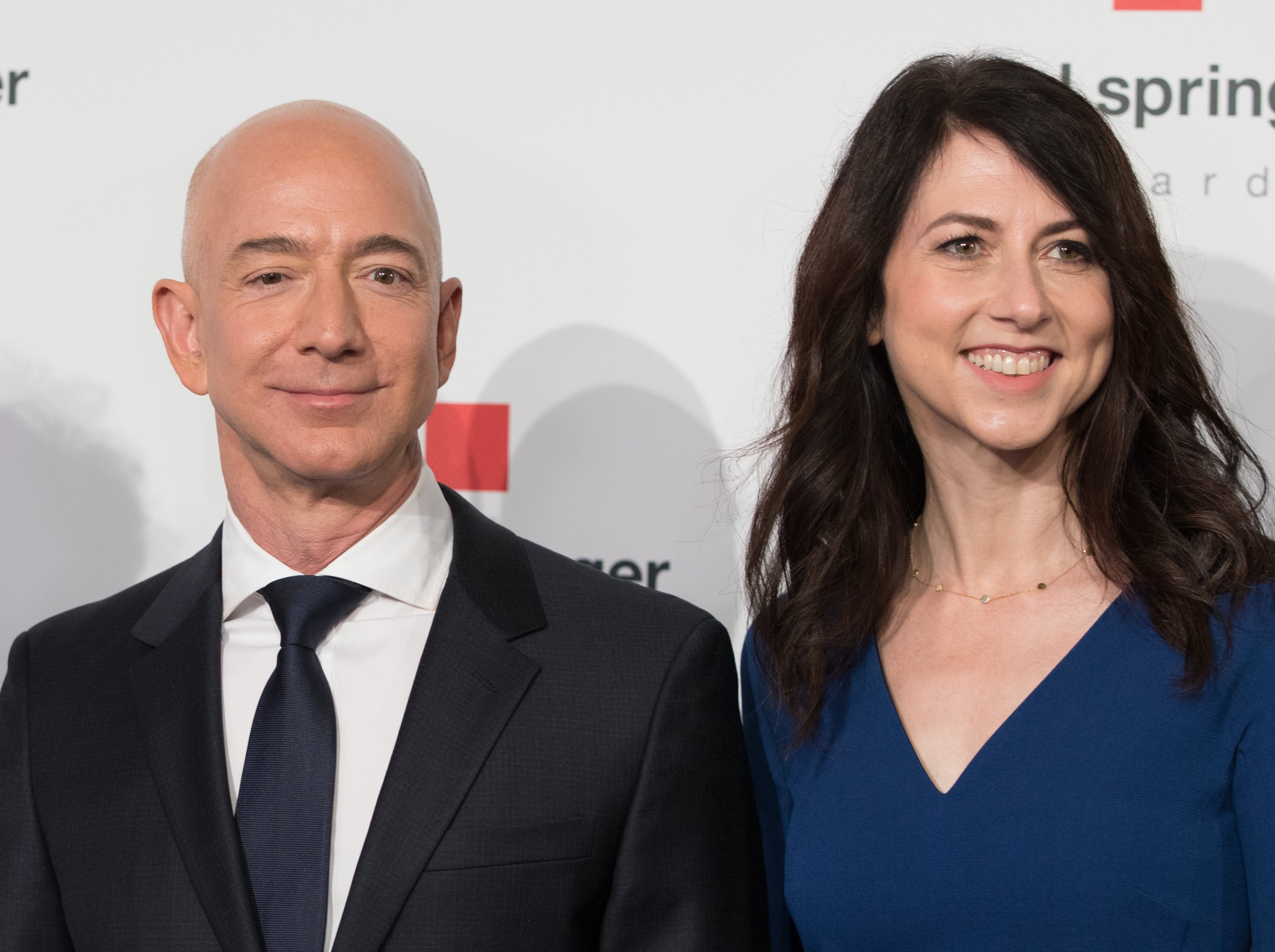 MacKenzie Scott (right) with her then-husband, Jeff Bezos, in 2018. Scott's Amazon shares have dropped 42 percent in the last year, according to a new report