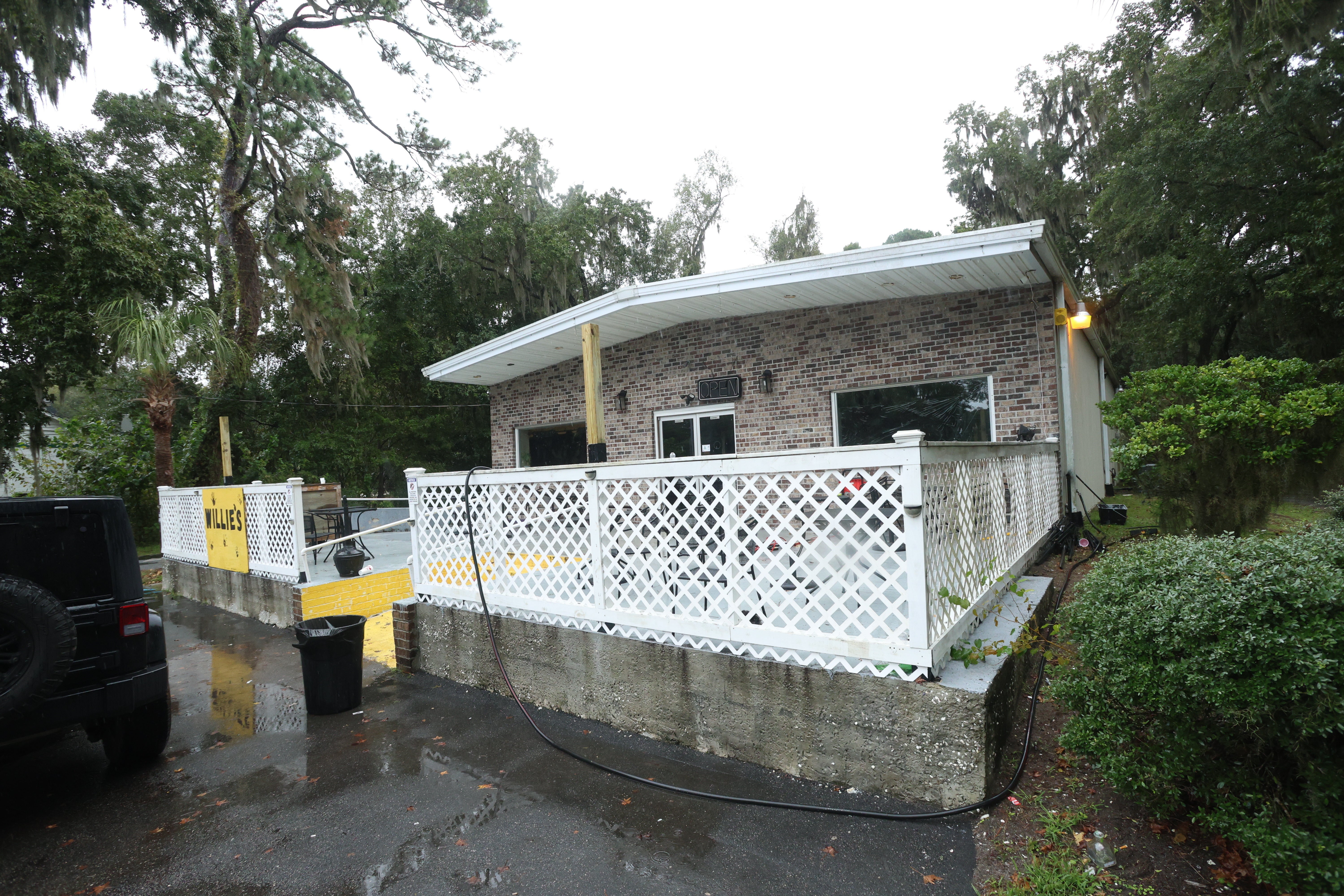 A vehicle is parked outside of Willie's Bar and Grill in St Helena Island, S.C. after a shooting occurred early Sunday, Oct. 12, 2025. (AP Photo/Lewis M. Levine)